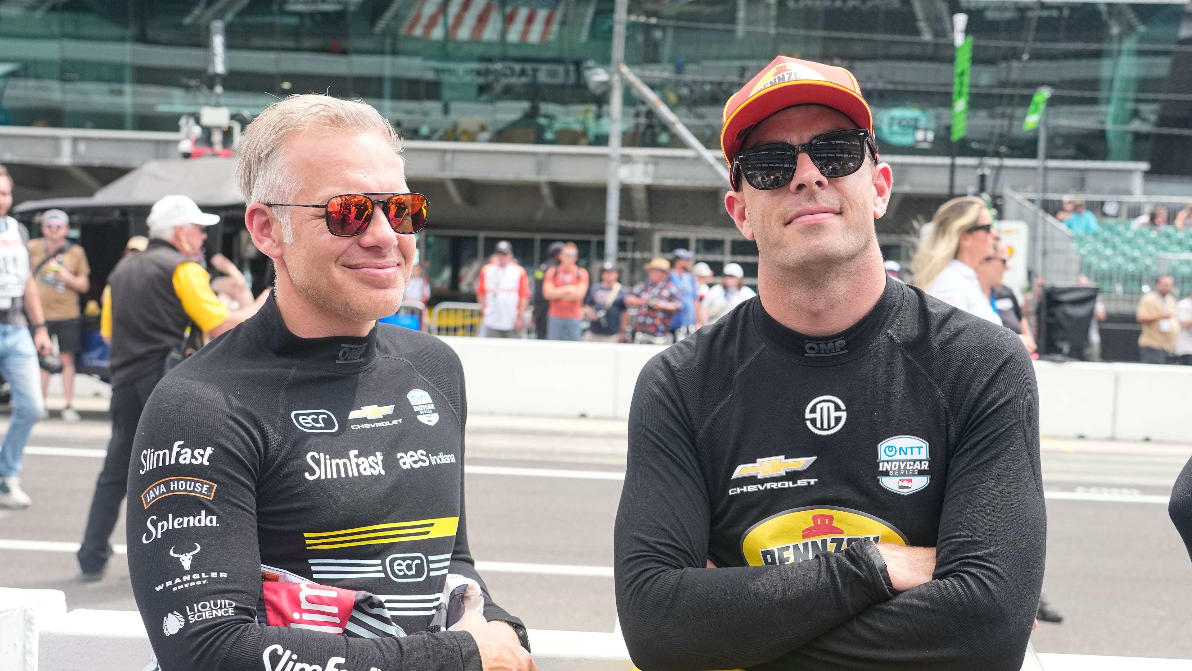 Ed Carpenter, left, talks with Scott McLaughlin before practice for the Indianapolis 500 auto race at the Indianapolis Motor Speedway in Indianapolis, Monday, May 18, 2026. (AP Photo/Michael Conroy)