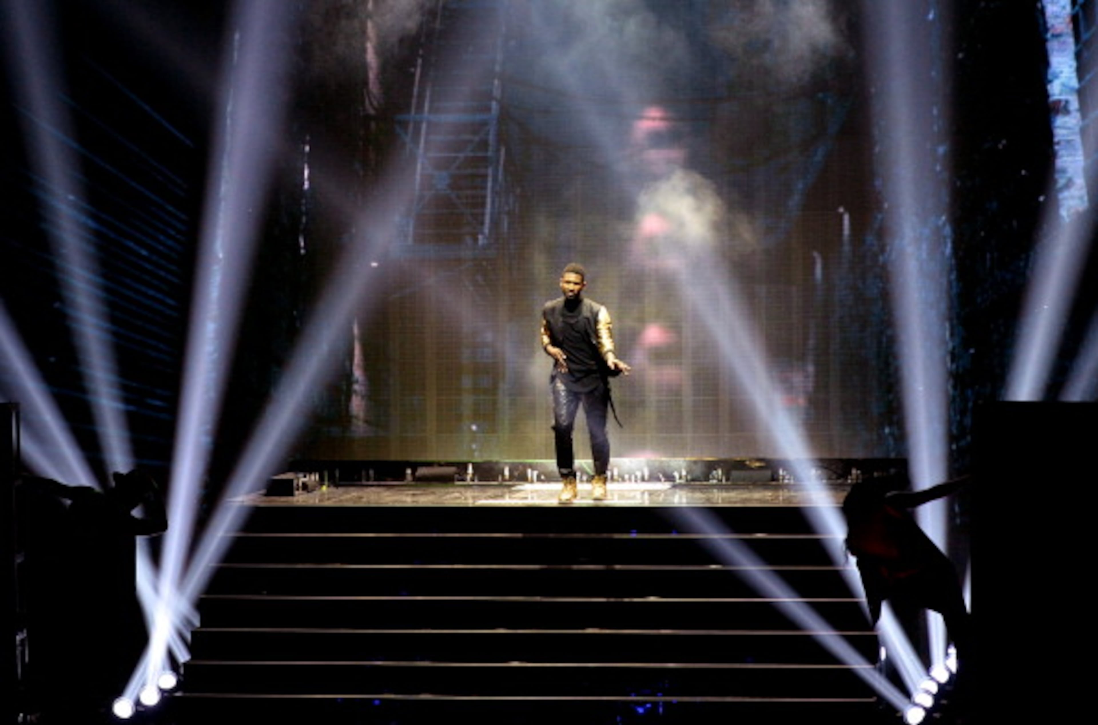 LOS ANGELES, CA - MAY 01: Singer Usher performs onstage during the 2014 iHeartRadio Music Awards held at The Shrine Auditorium on May 1, 2014 in Los Angeles, California. iHeartRadio Music Awards are being broadcast live on NBC. (Photo by Kevin Winter/Getty Images for Clear Channel)