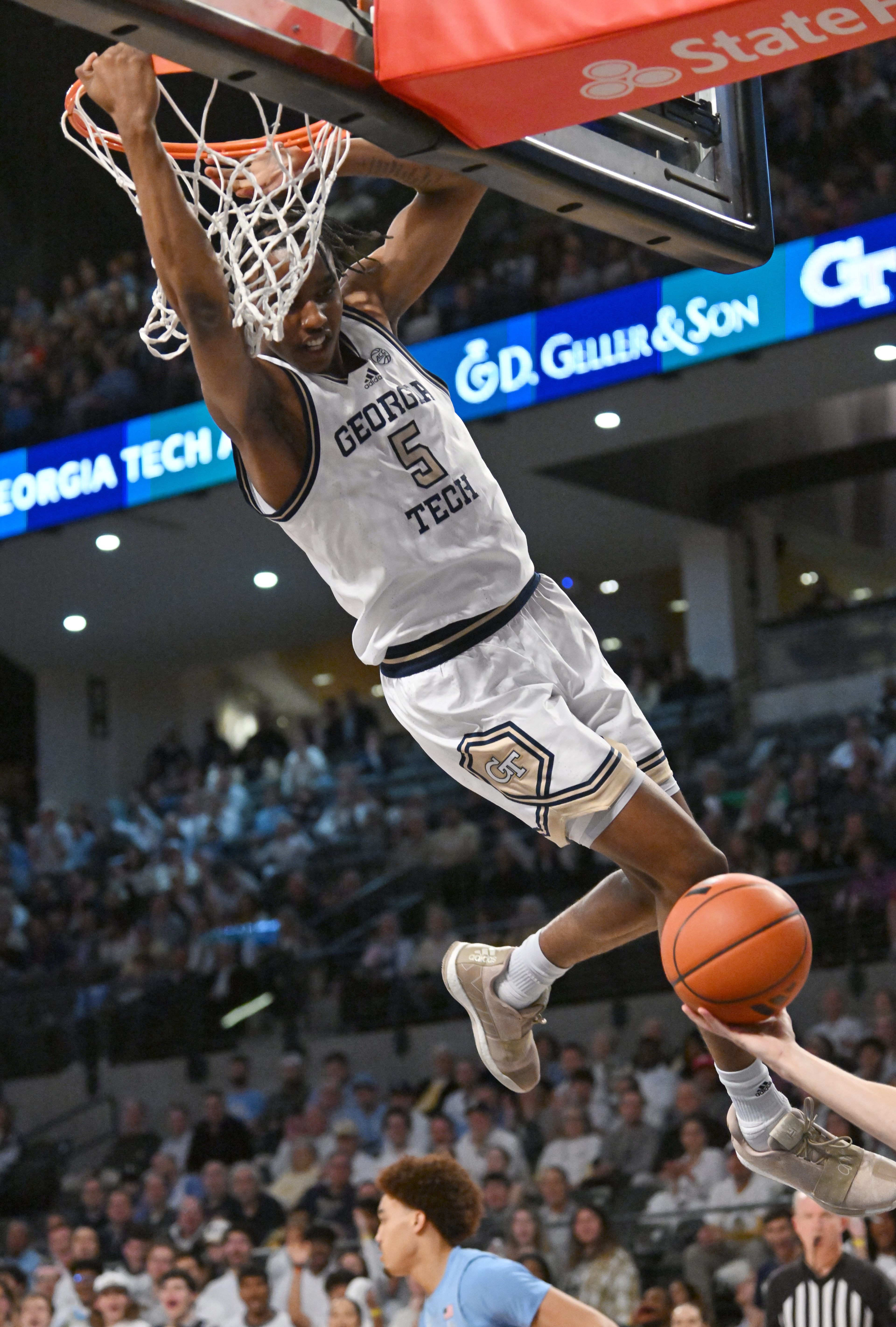 Georgia Tech forward Tafara Gapare (5) hangs on the basket after dunking the ball during the first half of an NCAA college basketball game at Georgia Tech’s McCamish Pavilion, Tuesday, January 30, 2024, in Atlanta. (Hyosub Shin / Hyosub.Shin@ajc.com)