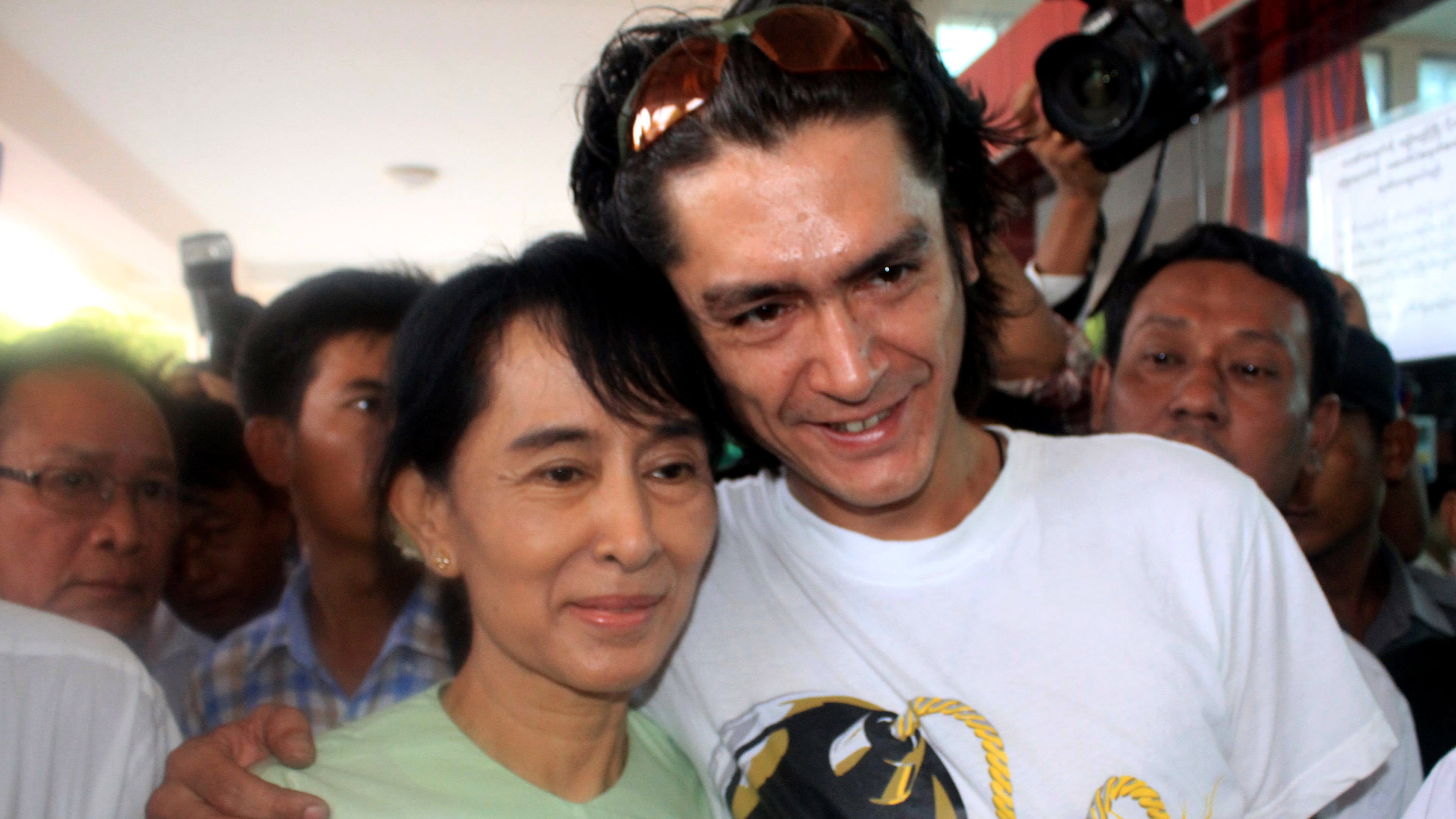 FILE- Myanmar democracy icon Aung San Suu Kyi and her son Kim Aris pose for a photo at Bagan airport before leaving for Yangon, July 8, 2011. (AP Photo/Khin Maung Win, File)