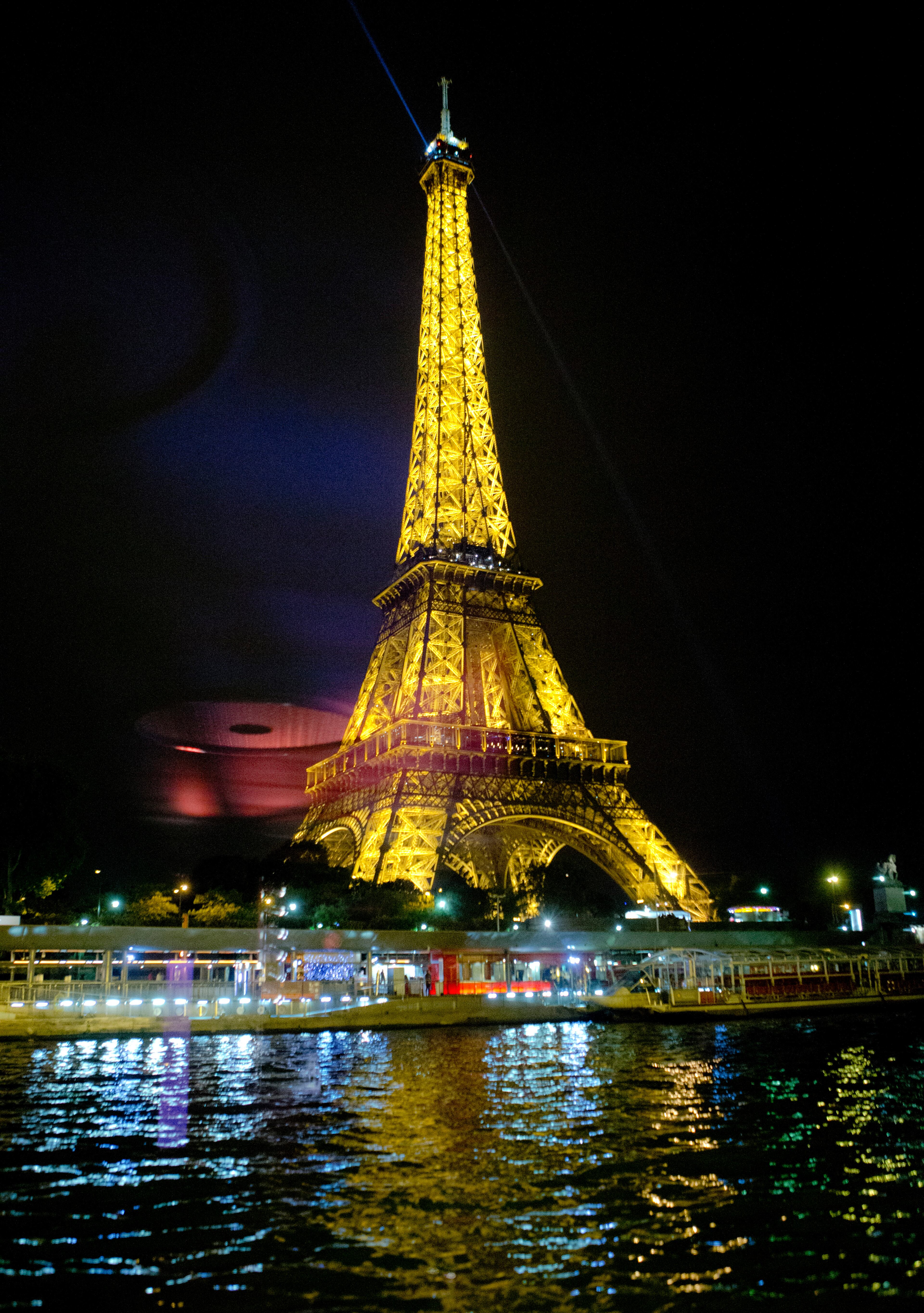 The Eiffel Tower is pictured from the Seine river in Paris, Wednesday night, Sept. 17, 2014. (AP Photo/Jacques Brinon)