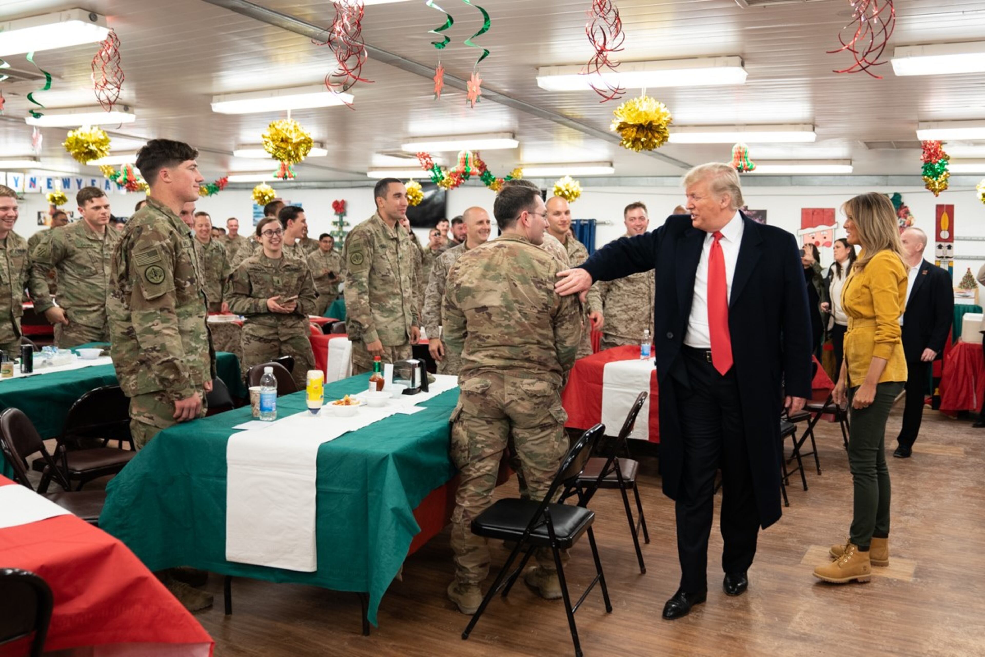 President Donald J. Trump, joined by First Lady Melania Trump, visits U.S. troops at their dining hall Wednesday, December 26, 2018, at the Al-Asad Airbase in Iraq.