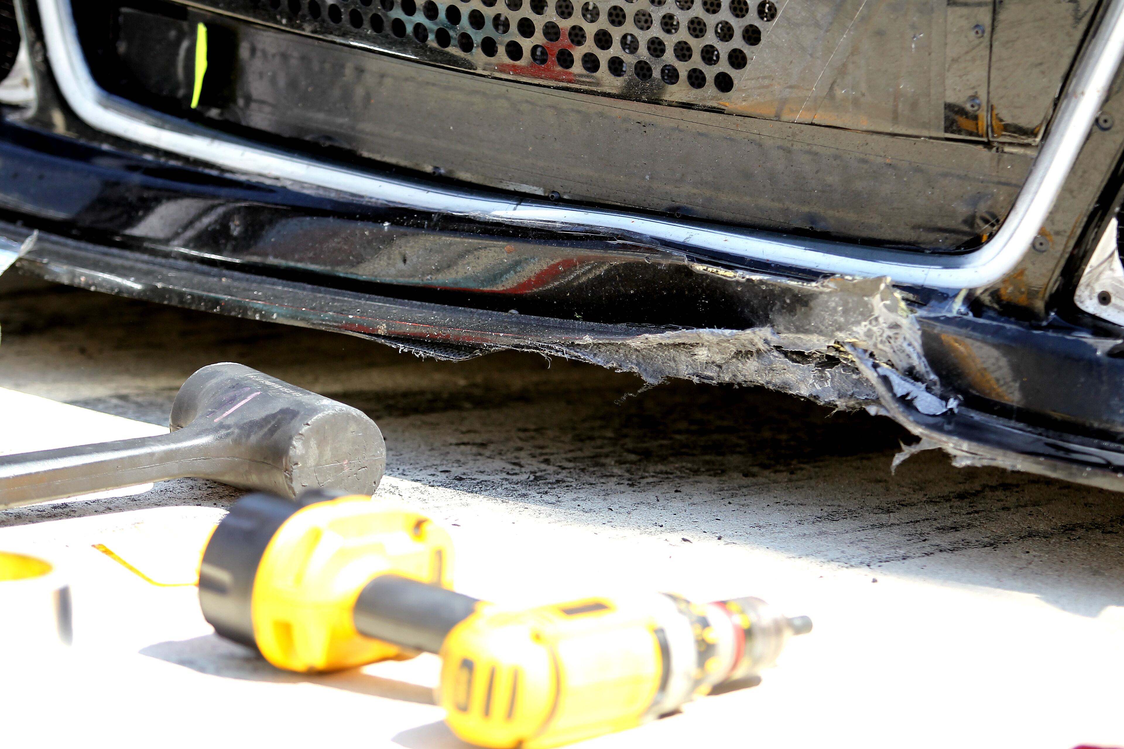 A detailed view of the damage caused to the #1 Cessna Chevrolet, driven by Jamie McMurray, by a piece of concrete that ripped up from the track during the NASCAR Sprint Cup Series FedEx 400 Benefiting Autism Speaks at Dover International Speedway on June 1, 2014 in Dover, Delaware. (Photo by Todd Warshaw/Getty Images)