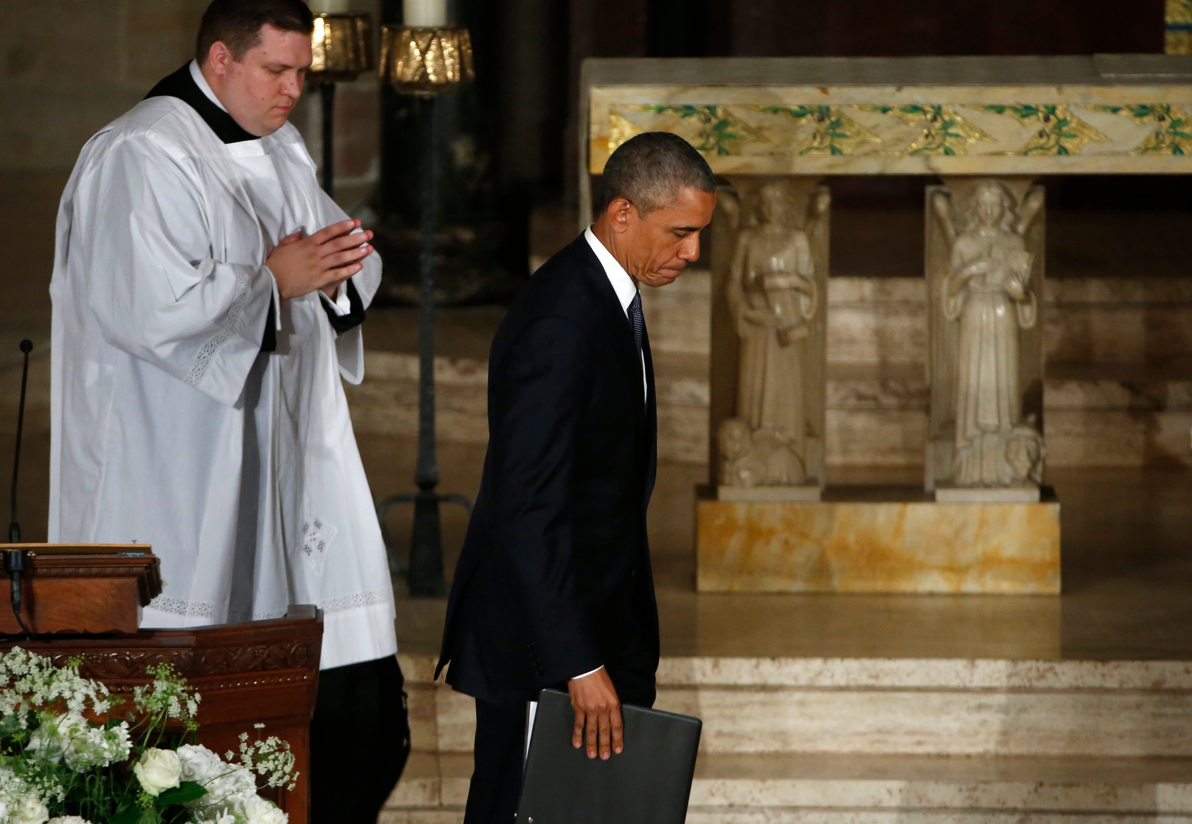 President Barack Obama leaves after delivering the eulogy during funeral services for Vice President Joe Biden's son, Beau Biden, Saturday, June 6, 2015, at St. Anthony of Padua Church in Wilmington, Del. (Yuri Gripas/Pool Photo via AP)