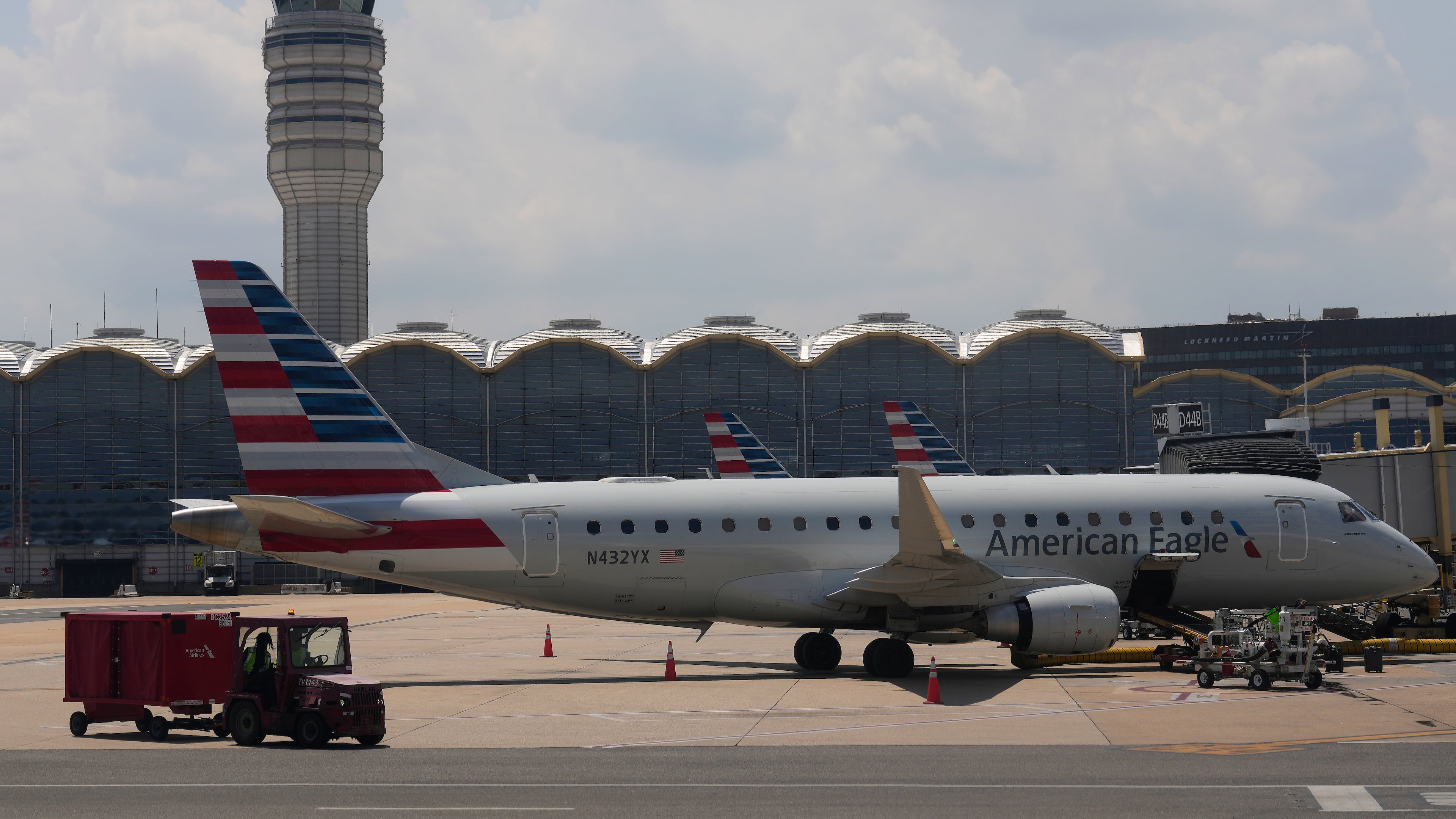 FILE - An American Eagle plane is parked at a gate at the Ronald Reagan Washington National Airport in Arlington, Va., June 29, 2026. (AP Photo/Carolyn Kaster, File)