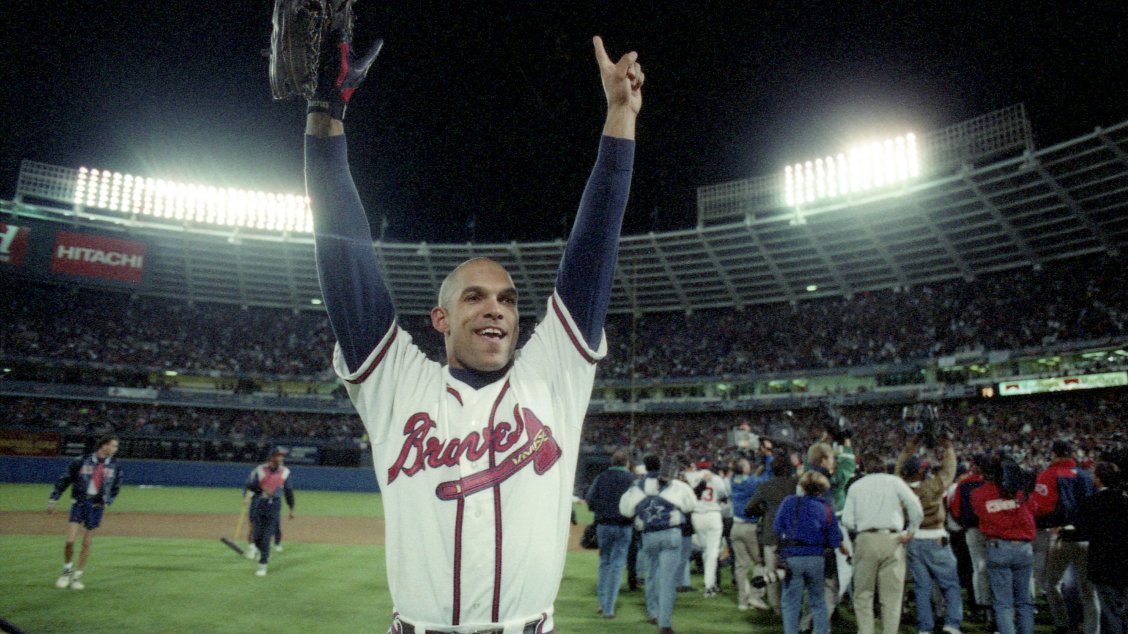 Braves outfielder David Justice celebrates winning the 1995 World Series in Game 6 on Oct. 28, 1995, in Atlanta. (Jonathan Newton / AJC)