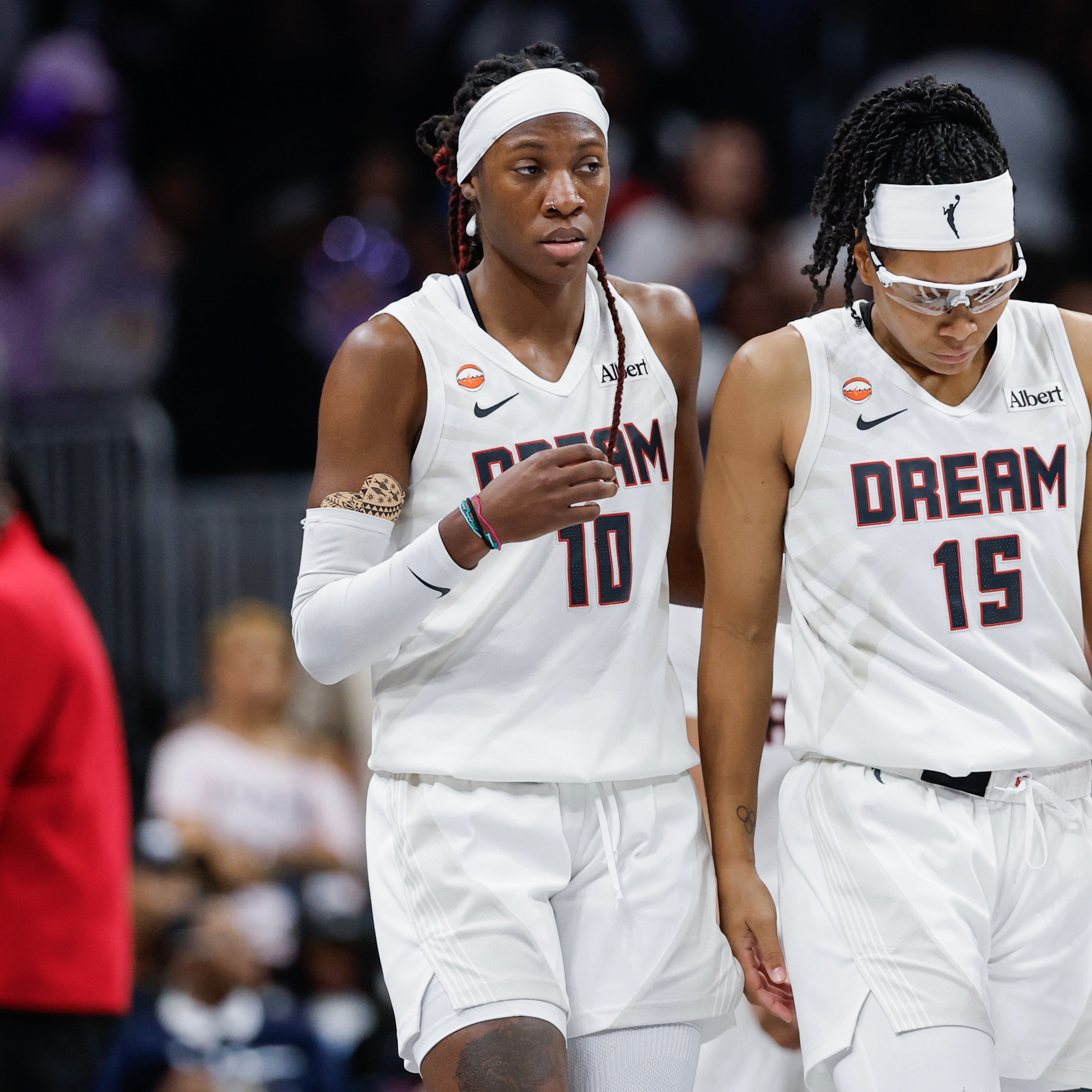 Atlanta Dream guard Rhyne Howard (left) reacts with Atlanta Dream guard Allisha Gray late in the second half of Game 4 of the WNBA Finals between the Atlanta Dream and the Golden State Valkyries, Saturday, Oct. 24, 2026, in Atlanta. (Erik S. Lesser for the AJC)