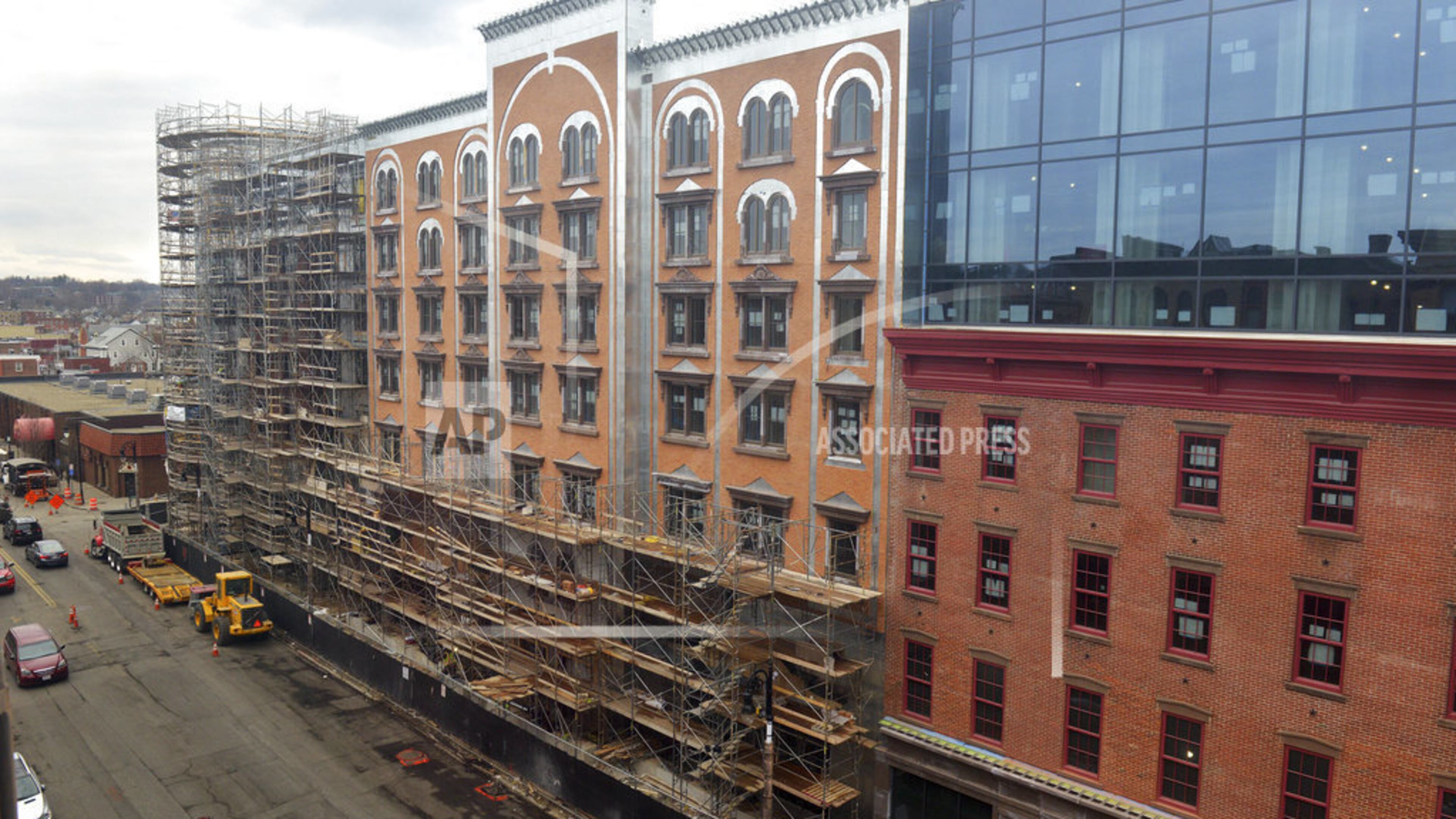 This April 3, 2018 photo shows construction progress on the MGM Casino in downtown Springfield, Mass., which is on track to open in August, a few weeks ahead of schedule. MGM Resorts International President Bill Hornbuckle said in an interview with The Associated Press on Wednesday, April 25, that August 24 is the new planned opening date for its $960 million downtown resort complex. The company had previously envisioned opening it sometime in September. (Don Treeger/The Republican via AP)
