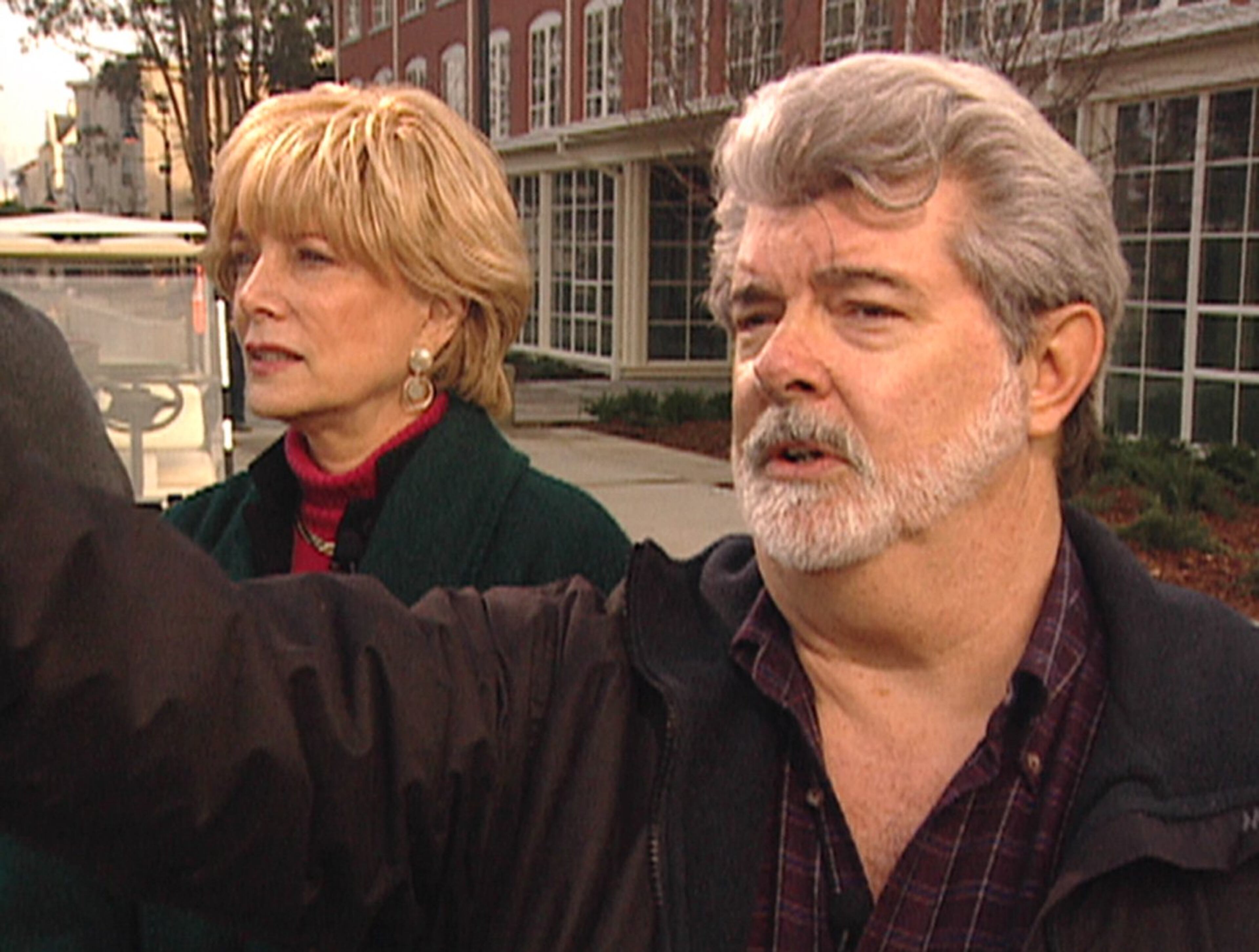 This photo from video supplied by CBS News shows filmmaker George Lucas touring the old Presidio grounds in San Francisco, which will be developed into the new headquarters of LucasFilm, with Lesley Stahl during an interview on Jan. 24, 2005, about his upcoming and last "Star Wars" film.