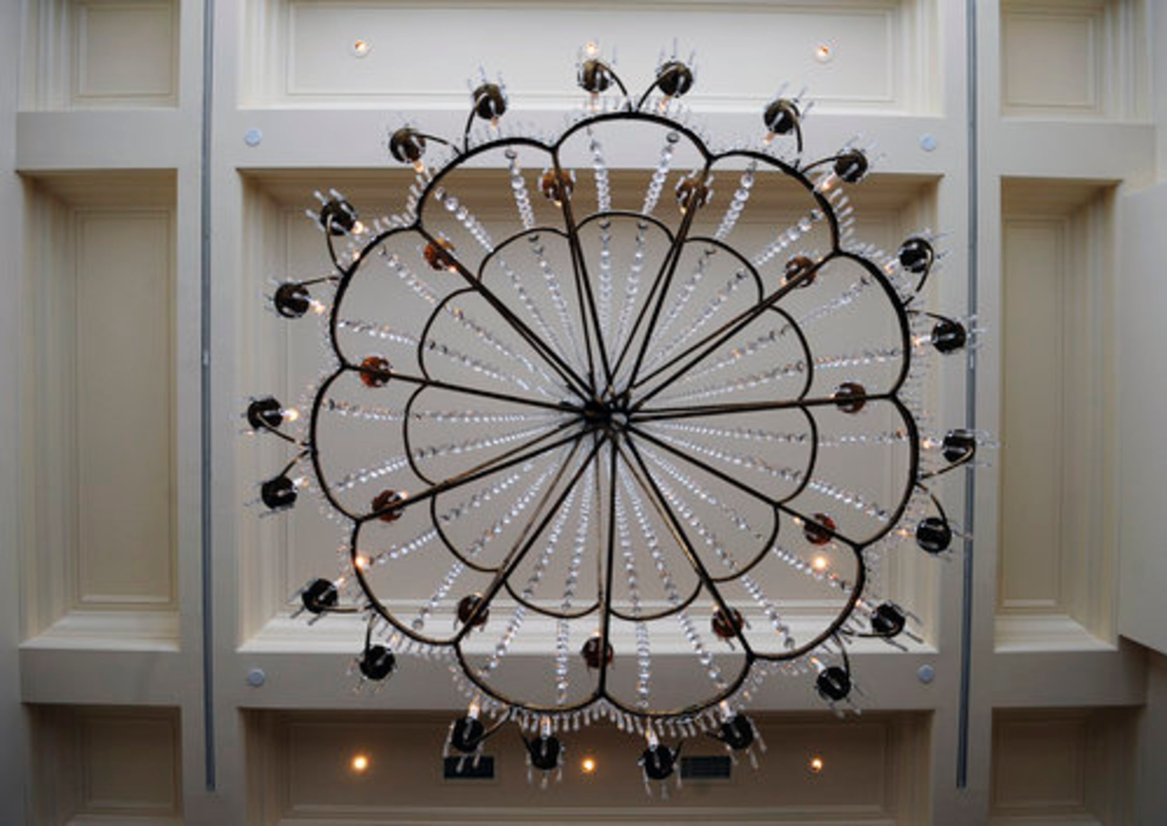 This spectacular crystal chandelier descends gracefully from the coffered ceiling in the living room. The chandelier was so large it had to be hoisted into the penthouse by helicopter. Terwilliger is offering the penthouse, including the chandelier, for sale. Jo Ellen Bradley of Beacham & Company is handling the sale.