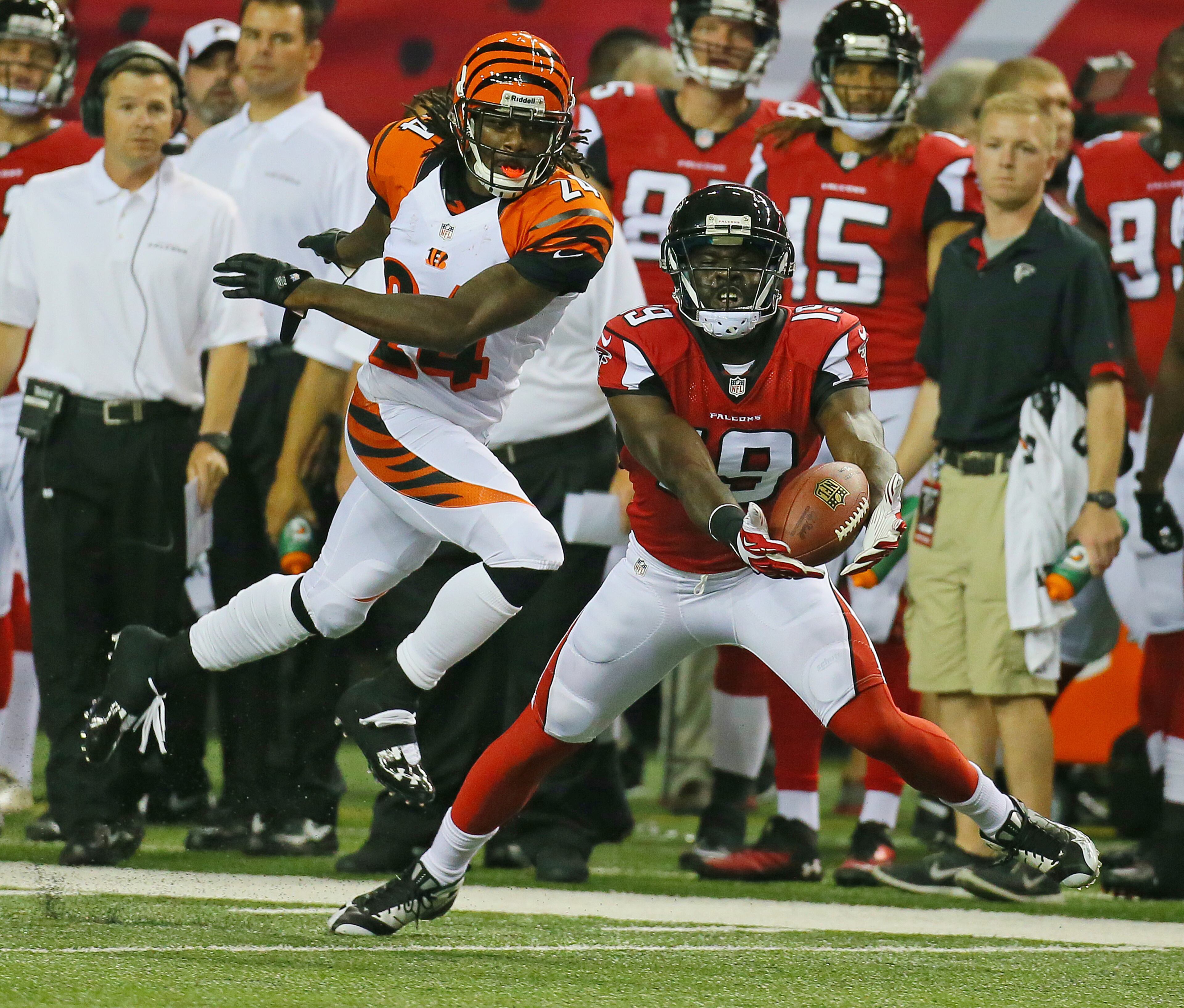 Falcons wide receiver Drew Davis catches a pass past Bengals cornerback Adam Jones during the first half.