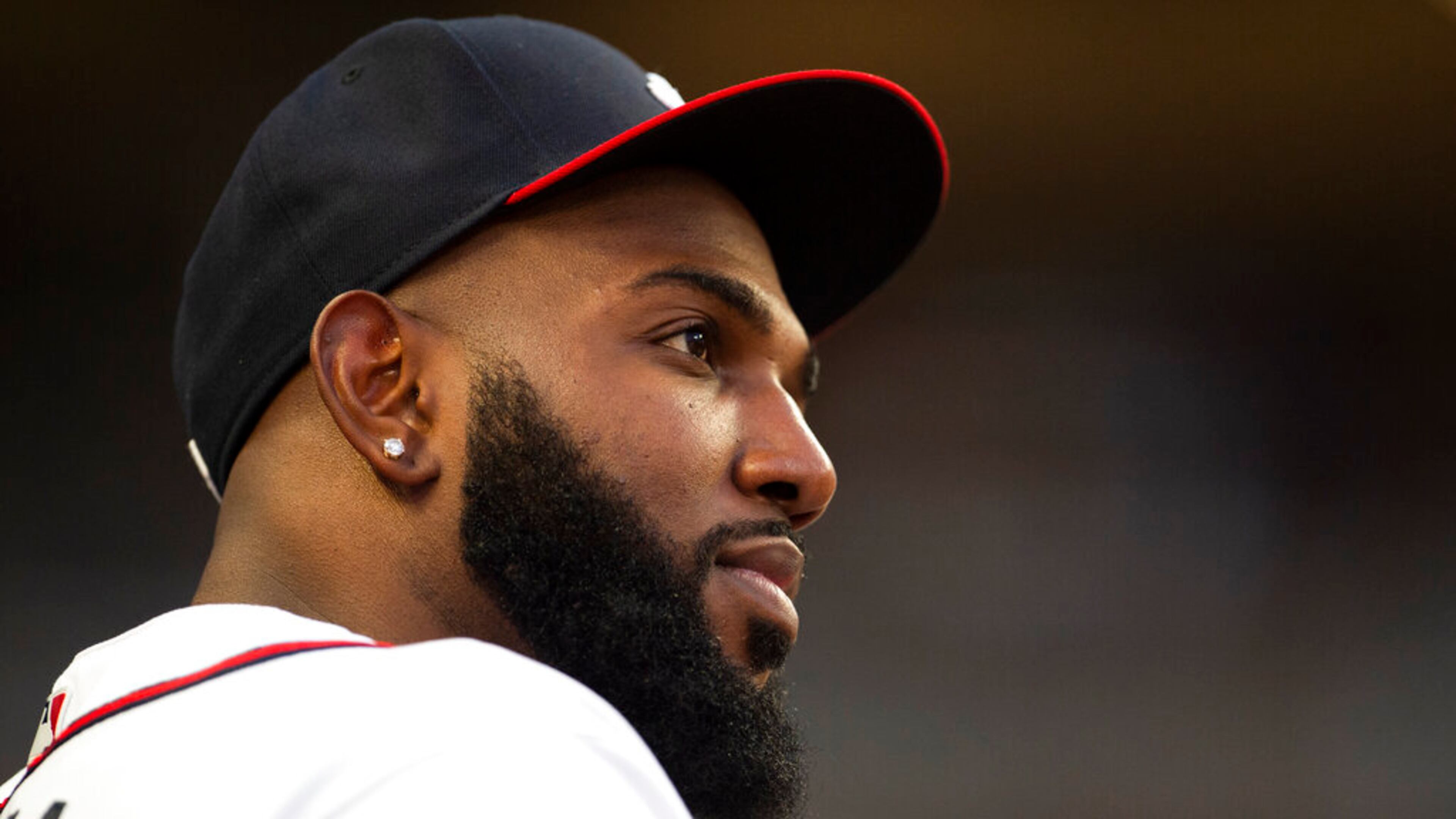Atlanta Braves Marcell Ozuna watches play from the dugout in the fourth inning of a baseball game against the Houston Astros Saturday, Aug. 20, 2022, in Atlanta. (AP Photo/Hakim Wright Sr.)