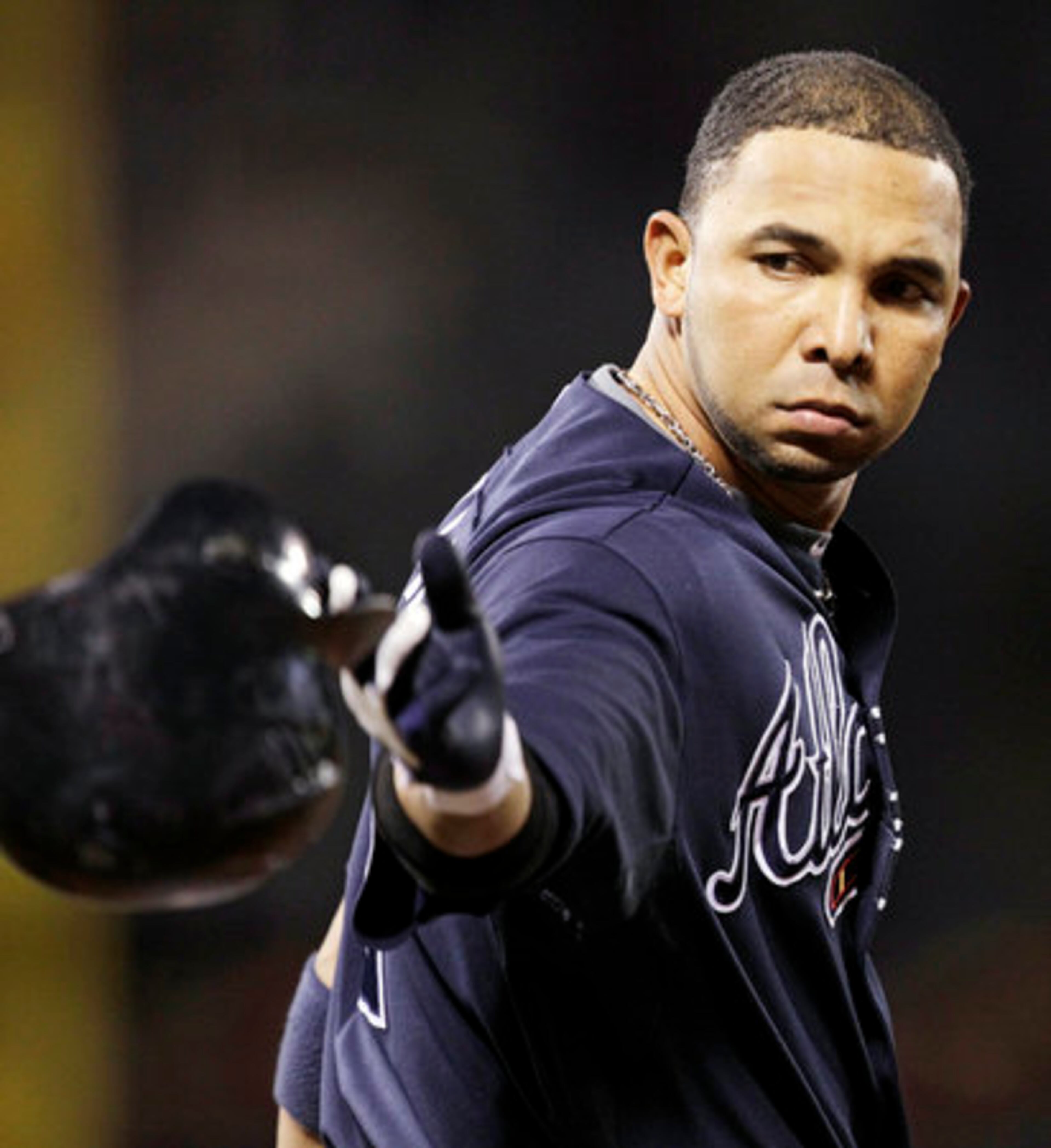 Atlanta Braves Alex Gonzalez throws his helmet after he popped out in the sixth inning of Game 2 of the National League Division Series baseball game against the San Francisco Giants in San Francisco, Friday, Oct. 8, 2010.