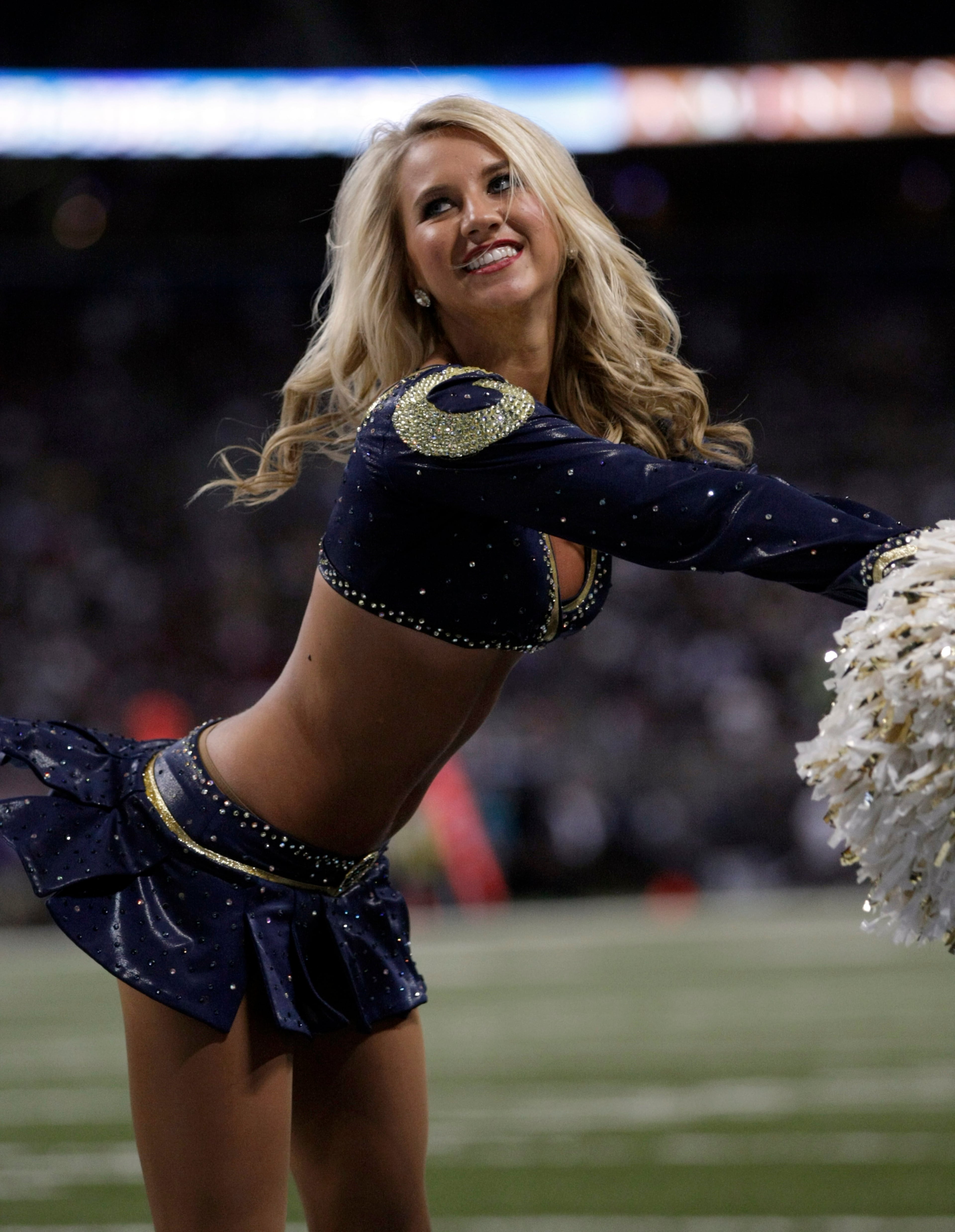 A St. Louis Rams cheerleader performs during the fourth quarter of an NFL football game between the St. Louis Rams and the Dallas Cowboys Sunday, Sept. 21, 2014, in St. Louis. The Cowboys won 34-31. (AP Photo/Tom Gannam)