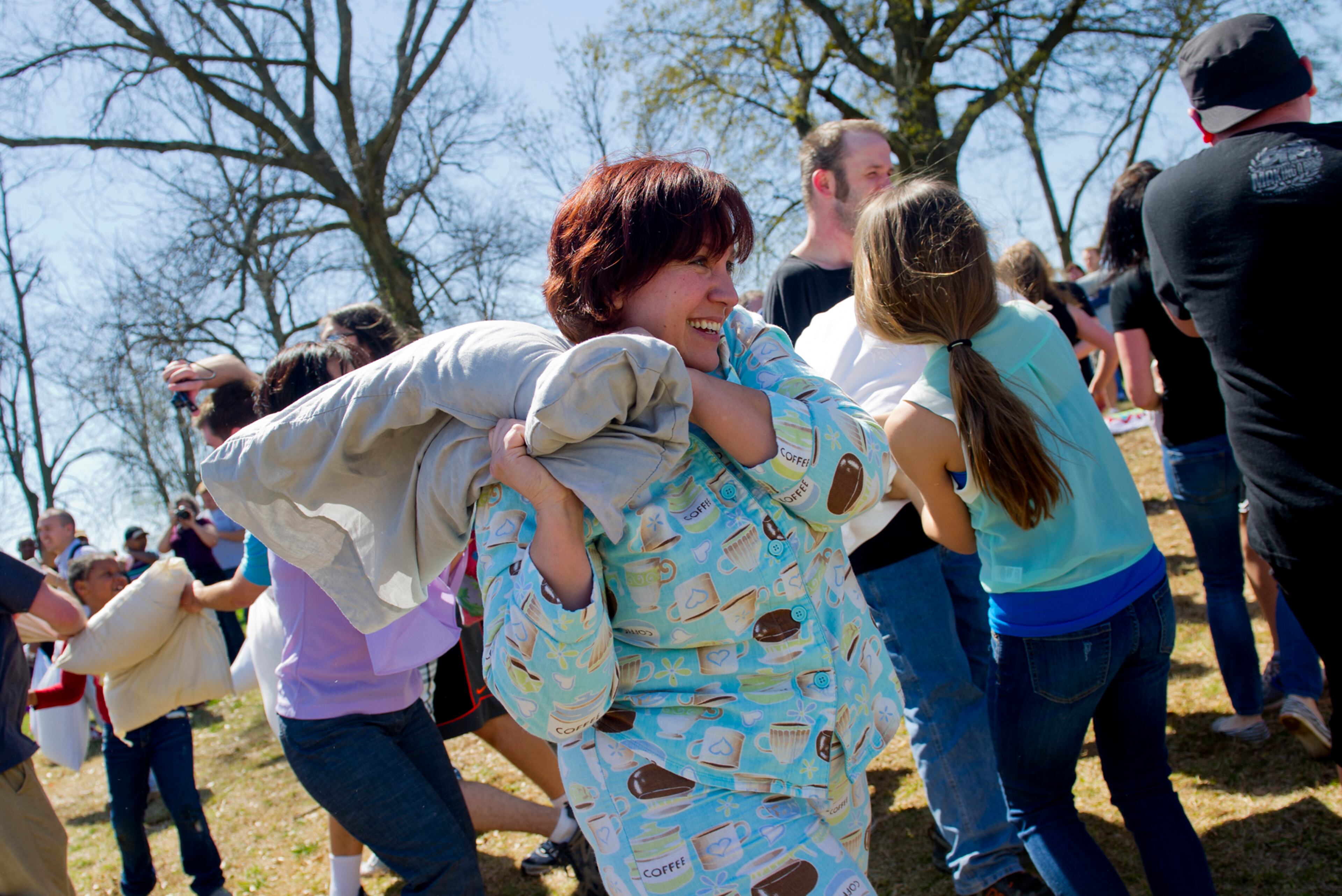 Kim Helms (center) battles new friends during the pillow fight.