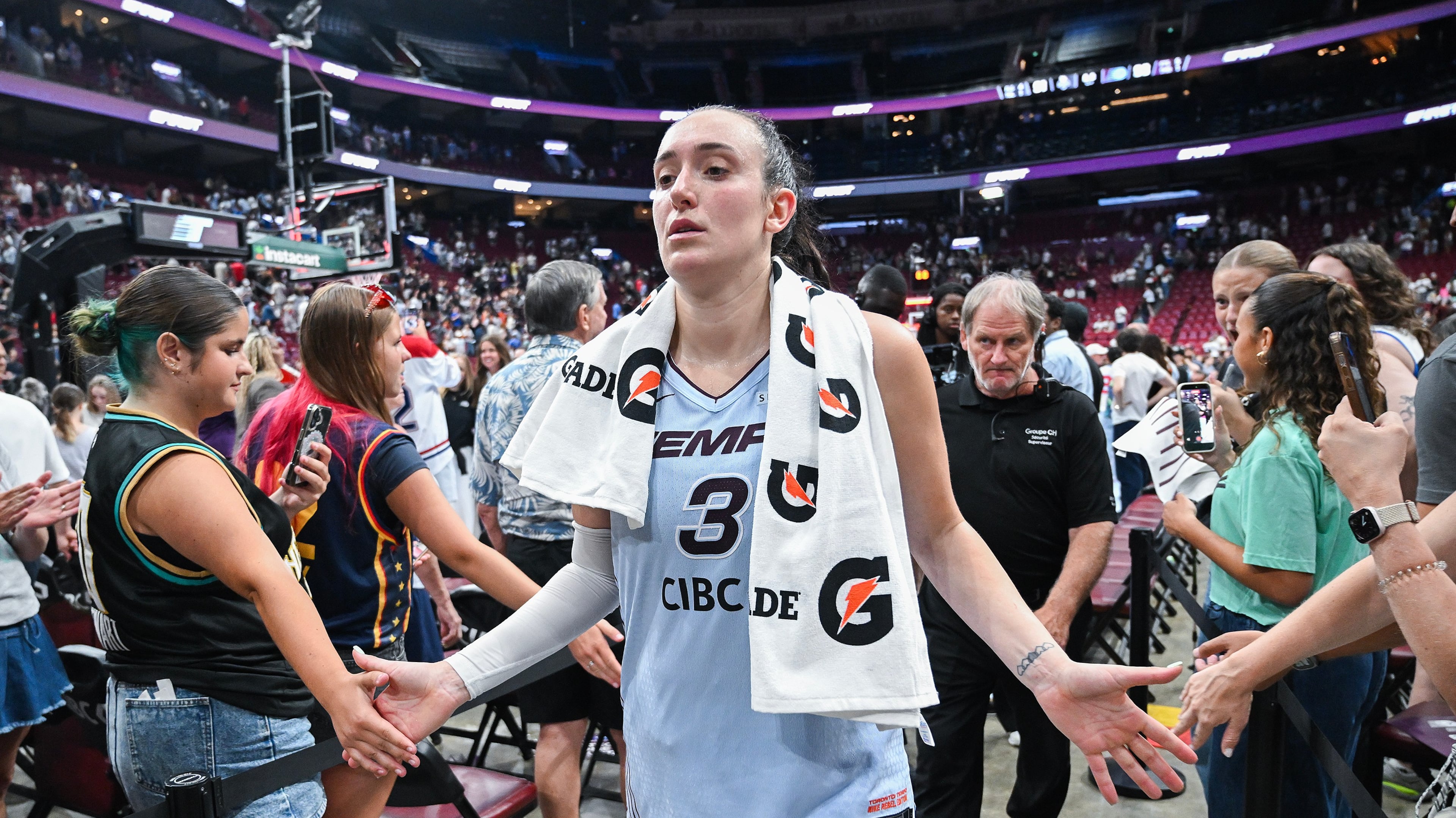Toronto Tempo's Marina Mabrey (3) greets fans following her team's win over the New York Liberty in a WNBA basketball game in Montreal, Sunday, July 12, 2026. (Graham Hughes/The Canadian Press via AP)