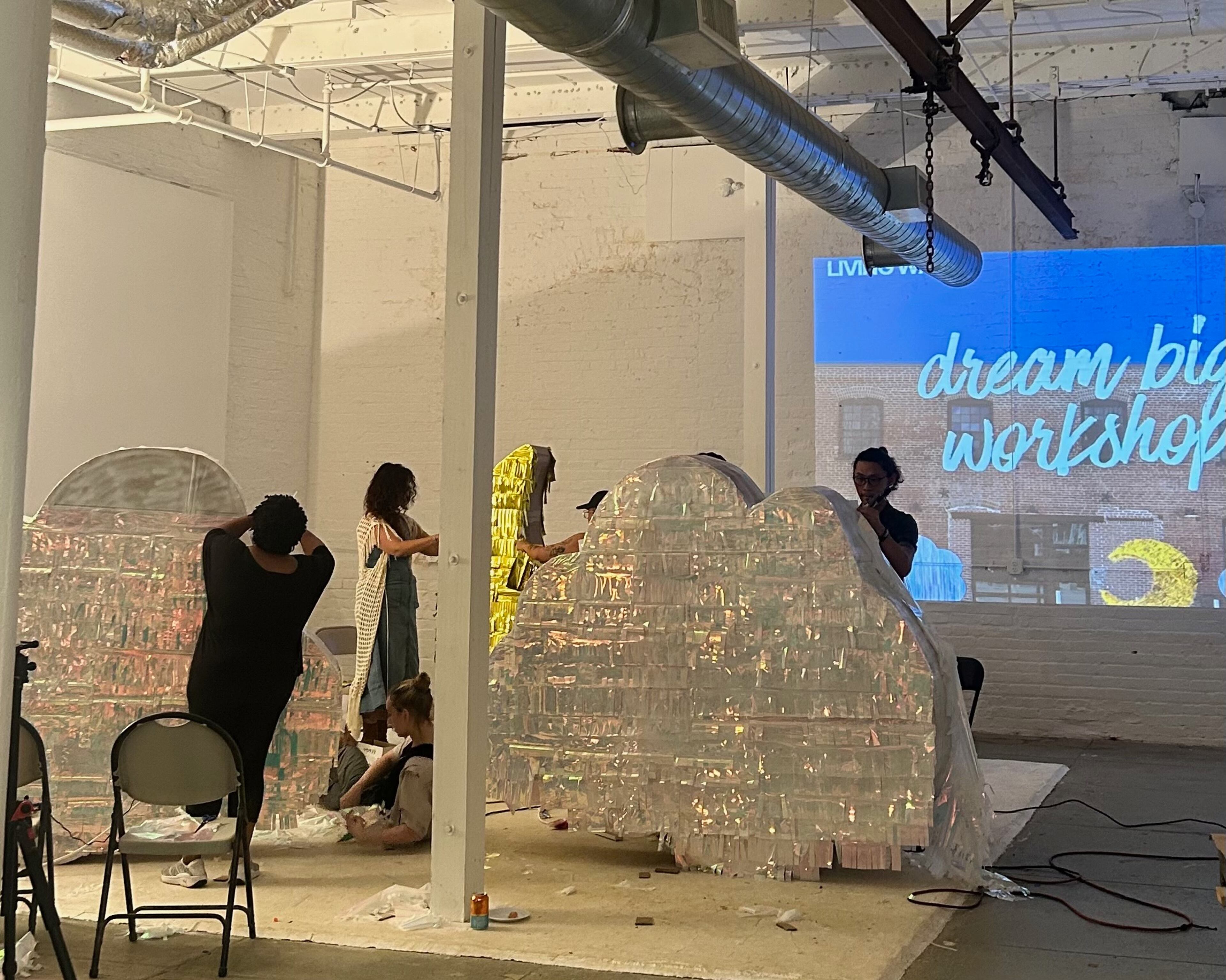 Living Walls artists construct massive piñatas for the nonprofit organization's upcoming quinceañero fiesta. The piñatas will be auctioned off as a fundraiser at the event. (Courtesy of Tatiana Bell)