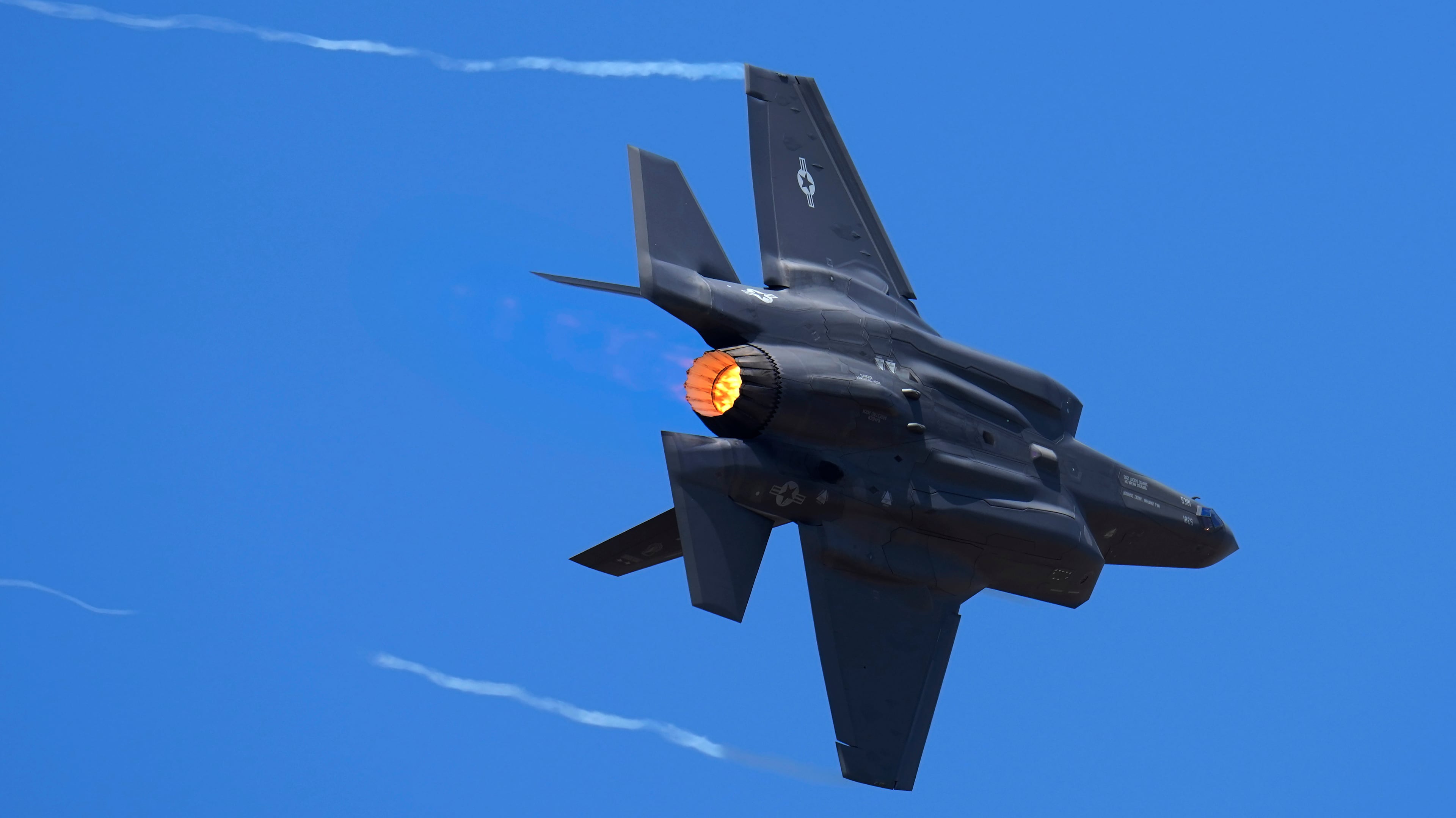 FILE - U.S. Air Force fighter aircraft F-35 performs aerobatic maneuvers on the second day of the Aero India 2023 at Yelahanka air base in Bengaluru, India, Feb. 14, 2023. (AP Photo/Aijaz Rahi, File)