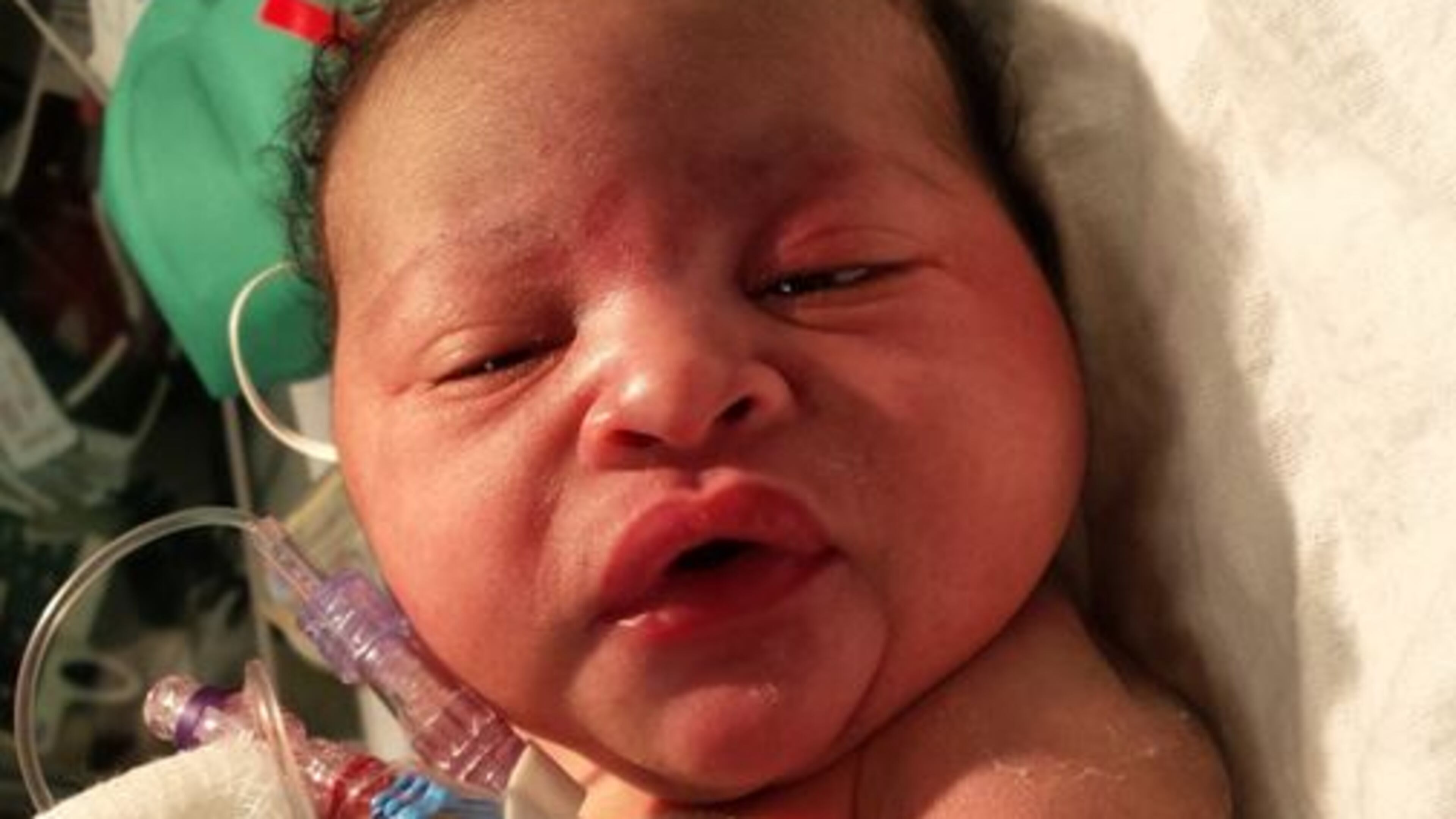 This newborn was found abandoned Monday night outside a home on Harlan Road in southwest Atlanta. (Credit: Channel 2 Action News)