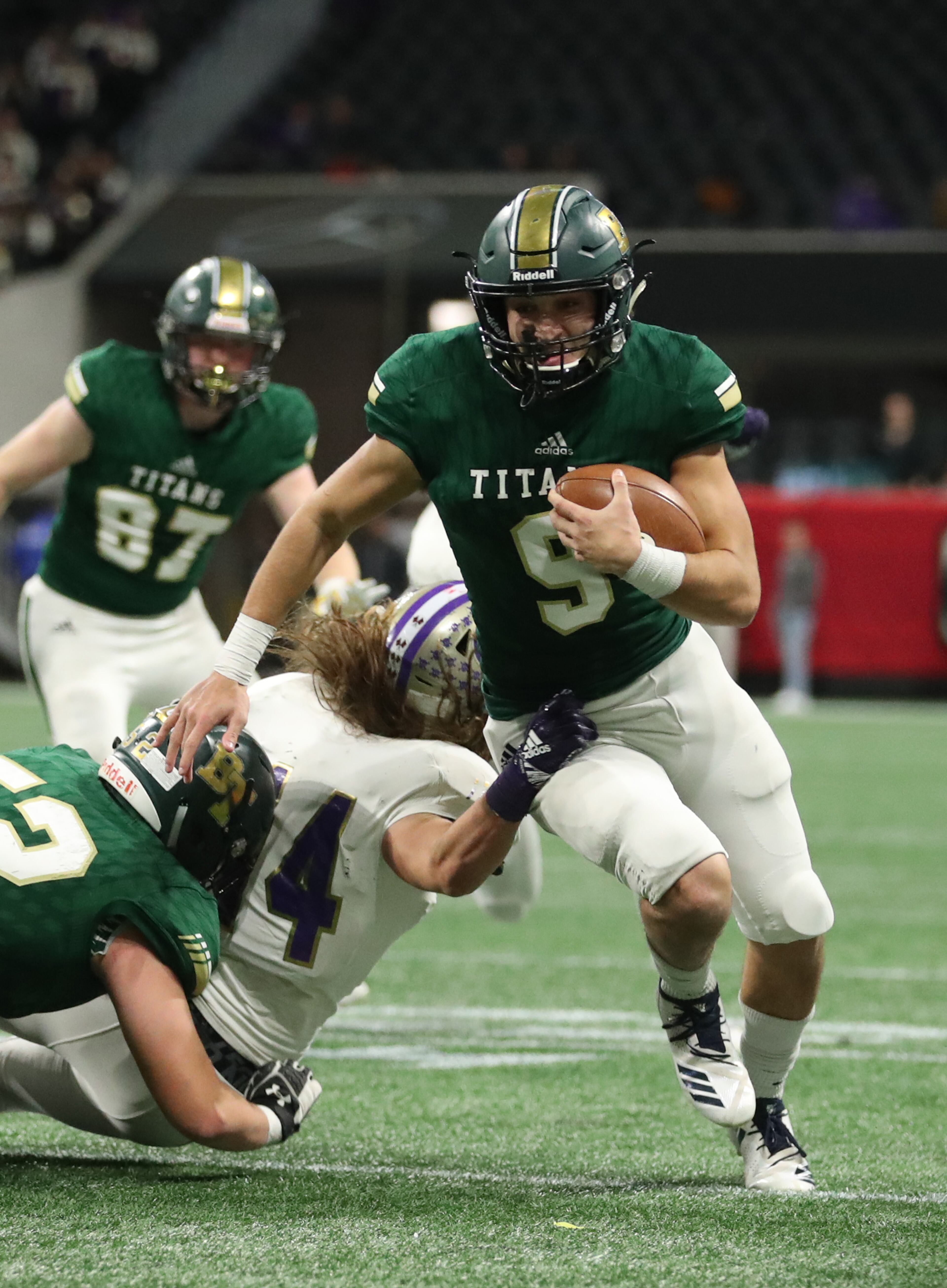 Blessed Trinity quarterback Jake Smith (9) runs for a first down in the fourth quarter against Cartersville during the Class AAAA State Championship at Mercedes-Benz Stadium Wednesday, December 12, 2018, in Atlanta. Blessed Trinity won 23-9. (JASON GETZ/SPECIAL TO THE AJC)