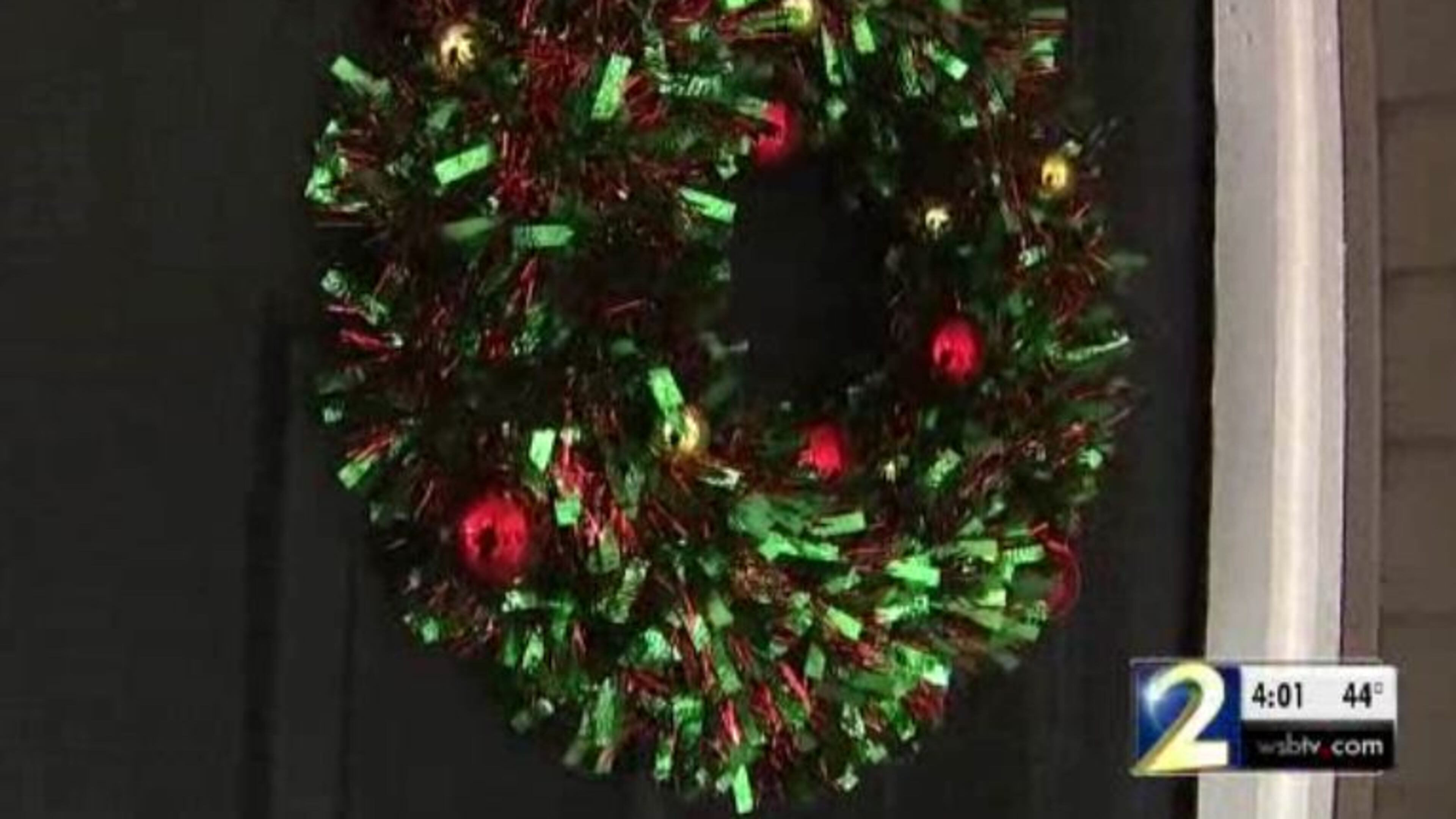 A Roswell woman says a gunman demanded cash at her apartment door.