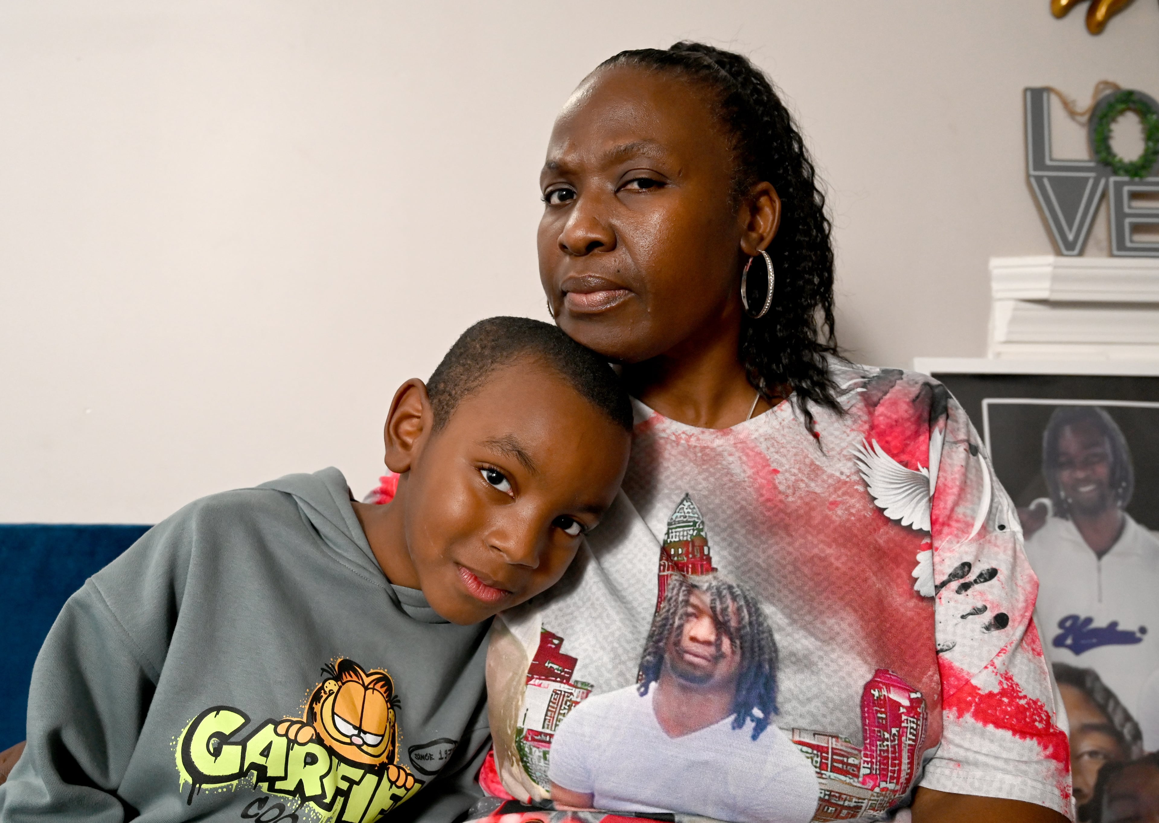 Colandra Atkinson is now taking care of her grandson, Santos Wyatt Jr., 8, after his father's death in 2025. (Hyosub Shin/AJC)