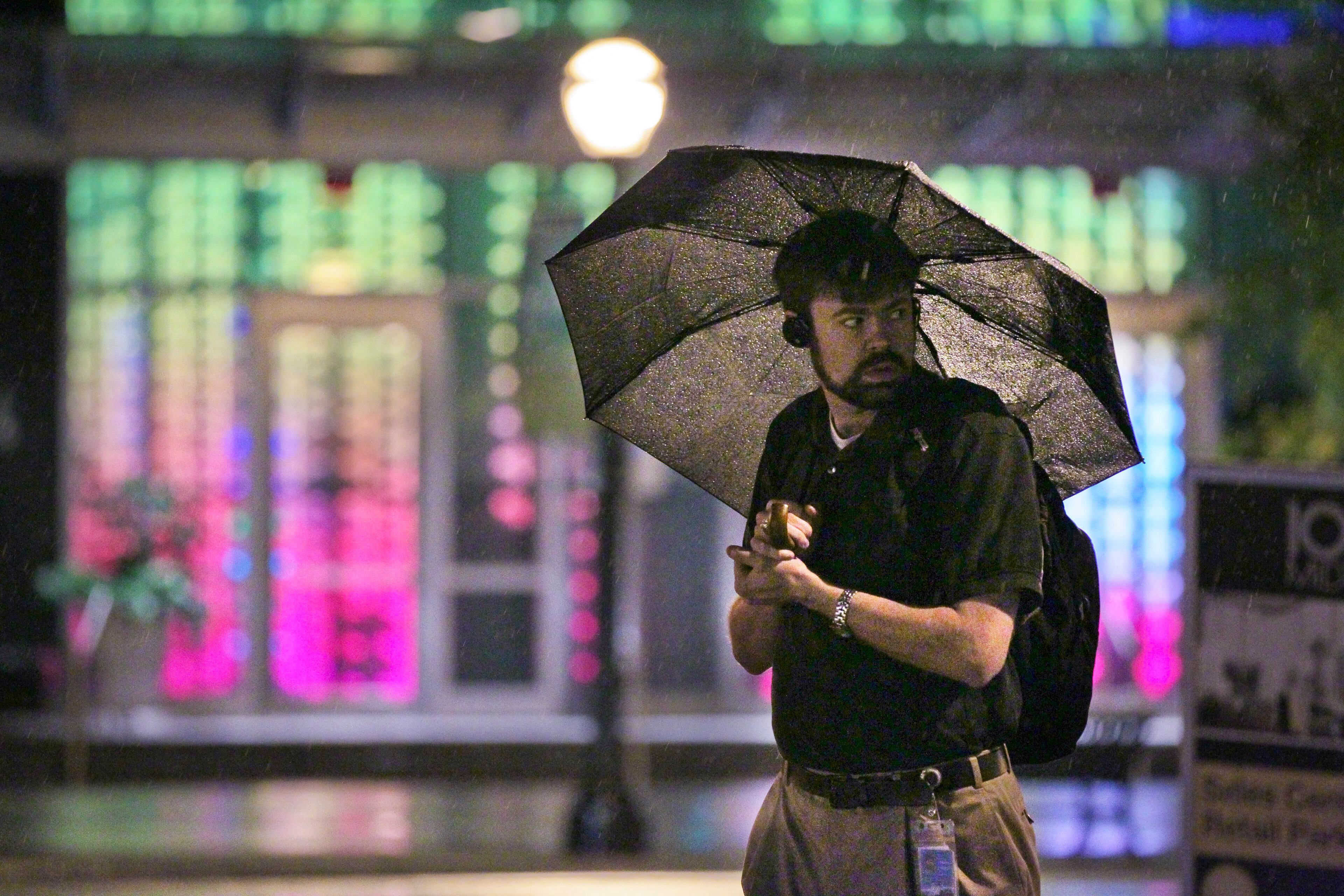 In this Oct. 18, 2012, file photo, Shelby Mayes heads into work and passes the colorful lights at 1075 Peachtree St.