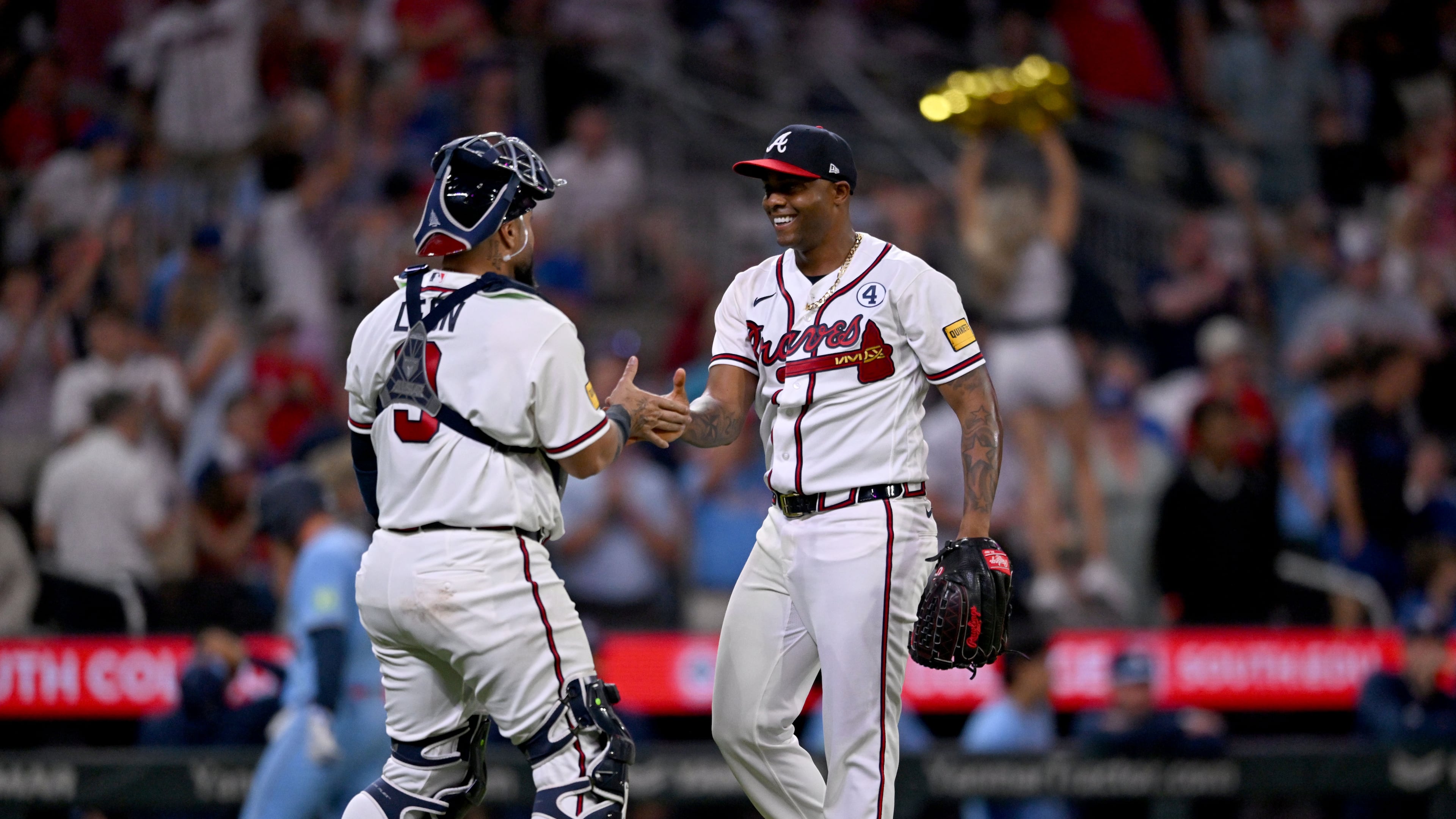Braves pitcher Raisel Iglesias (right) celebrates with catcher Sandy León after a win against the Blue Jays at Truist Park on Tuesday, June 2, 2026, in Atlanta. (Hyosub Shin/AJC)