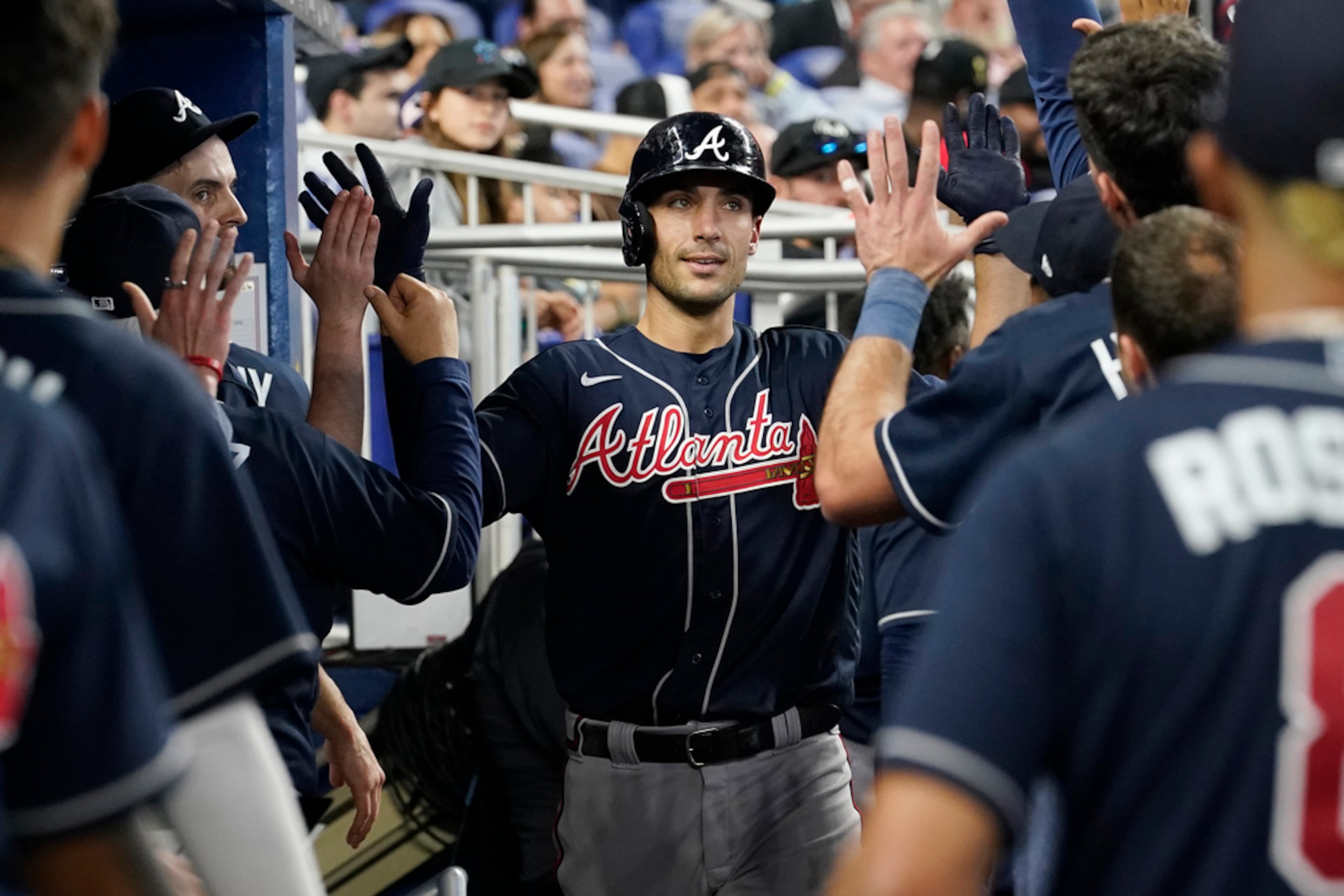 Atlanta Braves Matt Olson is congratulated by his teammates after hitting a home run in the ninth inning of a baseball game against the Miami Marlins, Thursday, May 4, 2023, in Miami. (AP Photo/Marta Lavandier)