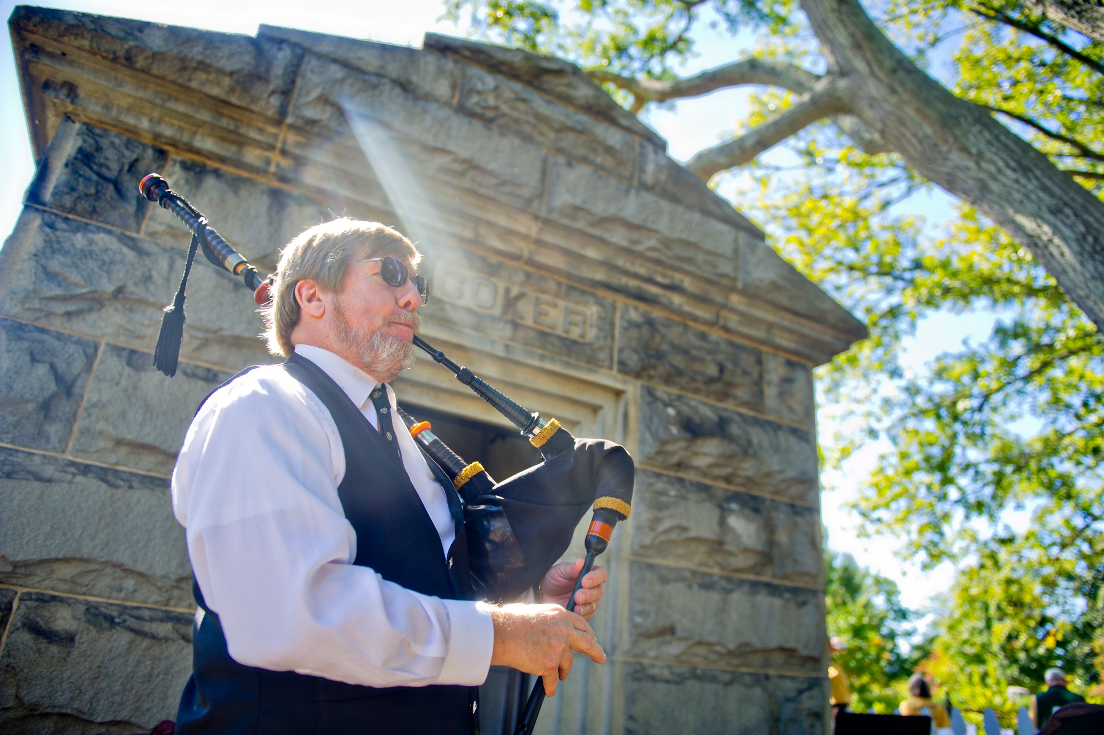 October 5, 2014 Atlanta - Henry Frantz plays the bagpipes in front of one of the crypts in Oakland Cemetery in Atlanta during the 35th annual Sunday in the Park on Sunday, October 5, 2014. Thousands of people strolled through the park on Sunday shopping, eating, listening to live music and enjoying the day. JONATHAN PHILLIPS / SPECIAL
