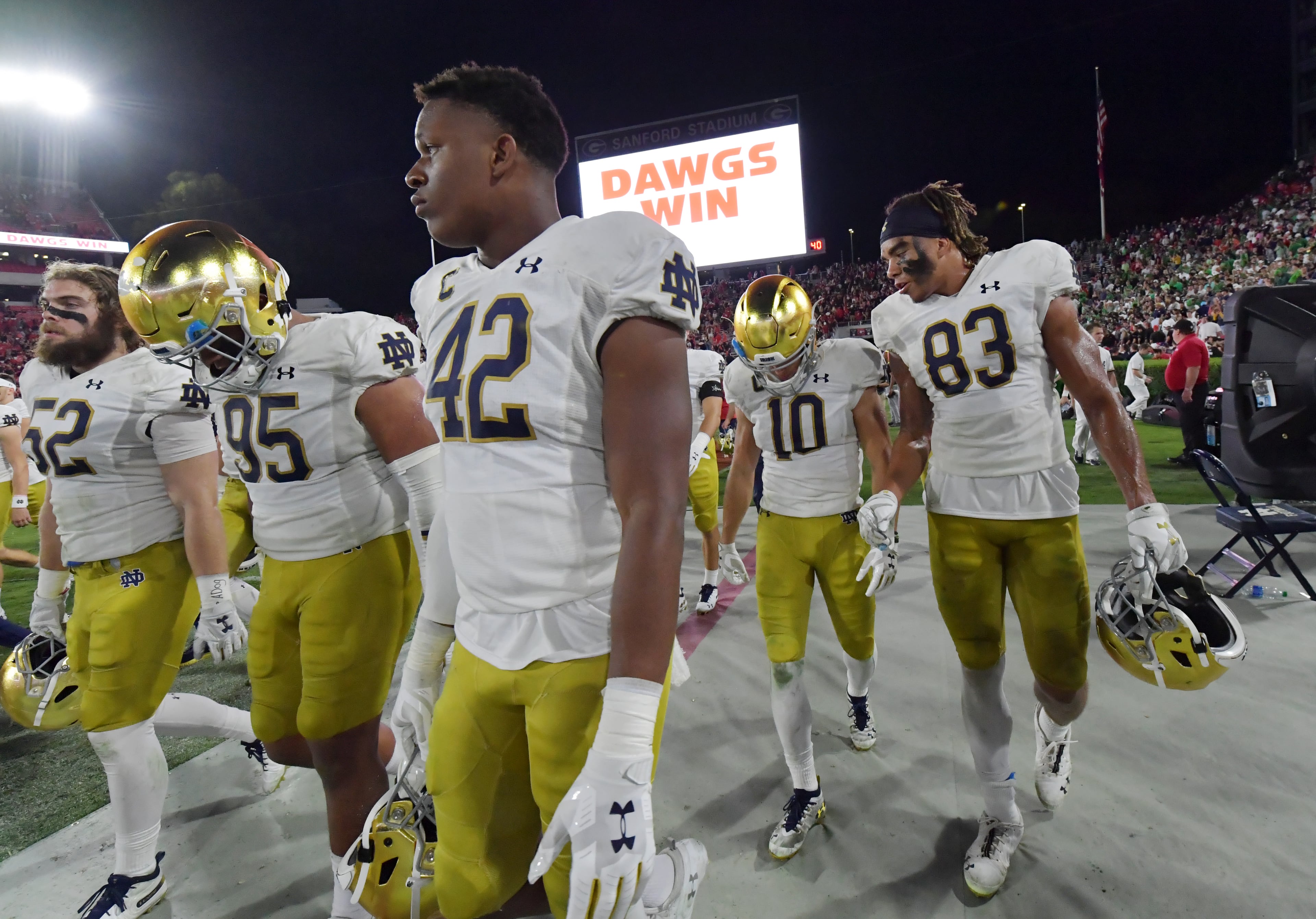 Notre Dame players leave after Georgia defeated them 23-17 in a NCAA college football at Sanford Stadium in Athens on Saturday, September 21, 2019. (Hyosub Shin / Hyosub.Shin@ajc.com)