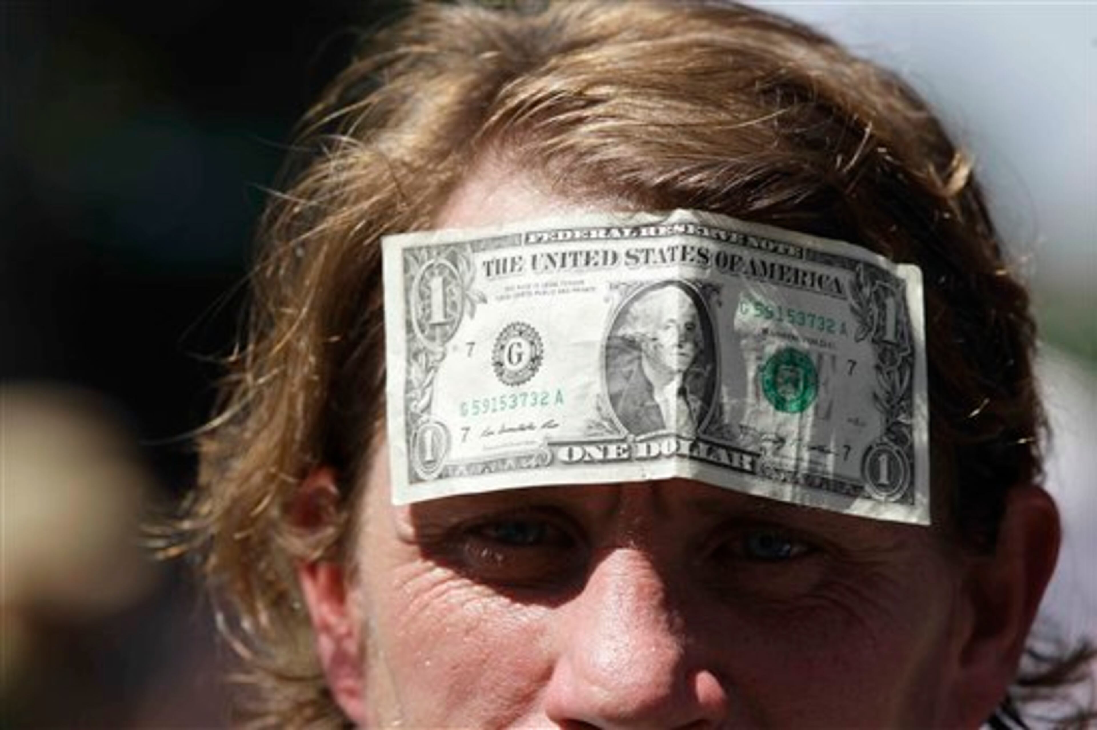 Demonstrators move toward downtown during a protest march, Sunday, Sept. 2, 2012, in Charlotte, N.C. Demonstrators are protesting before the start of the Democratic National Convention. (AP Photo/Chuck Burton)