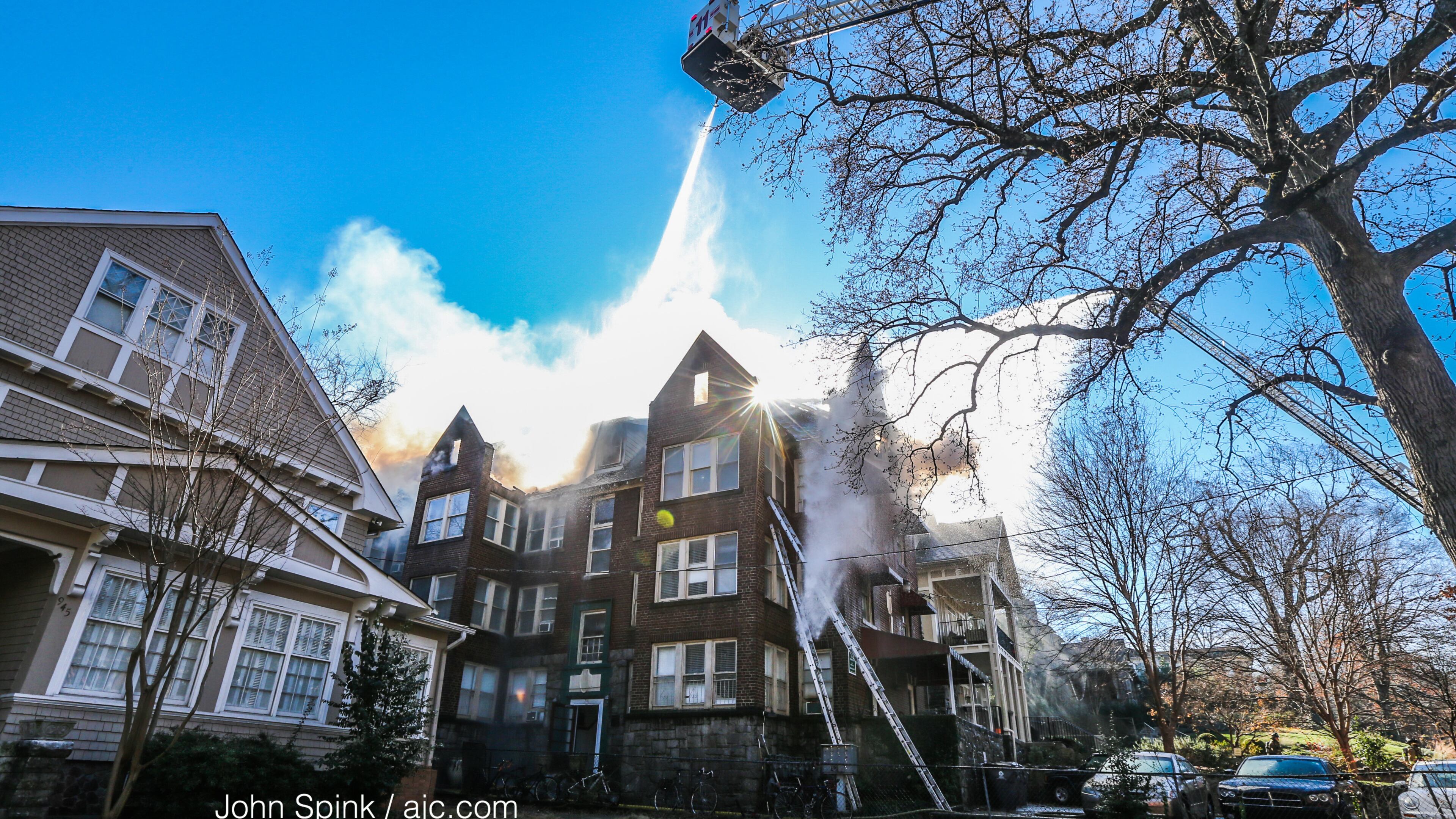 Atlanta firefighters battle a blaze at a three-story apartment building in Midtown.