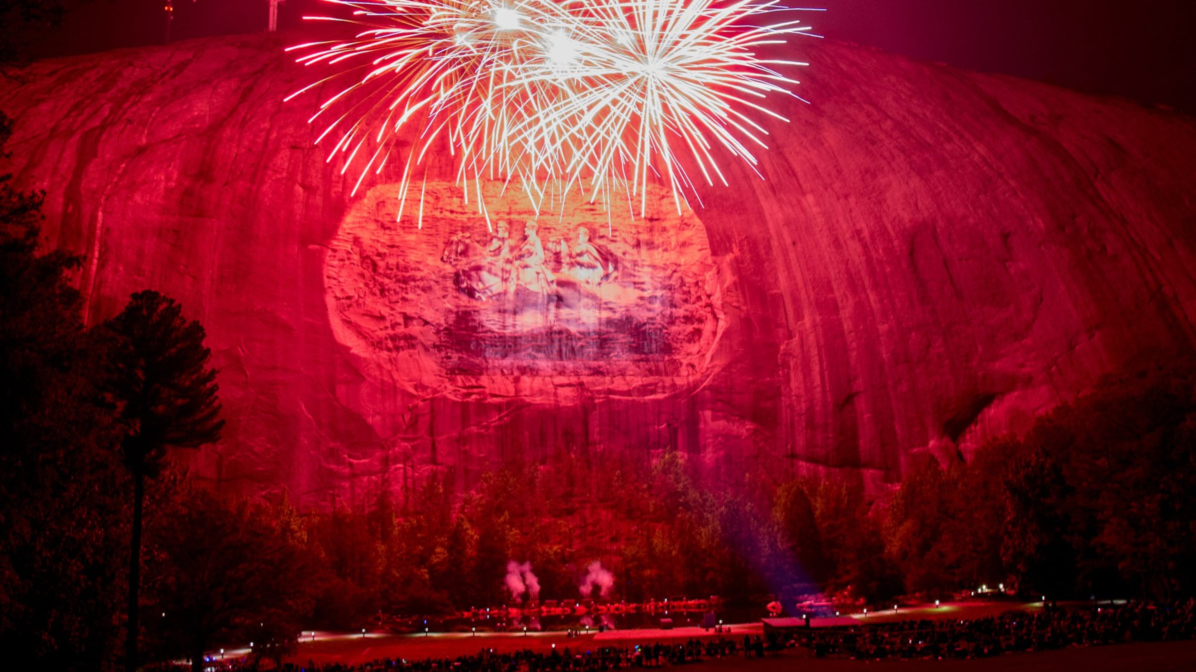 Fireworks explode during the laser show at Stone Mountain Park. STEVE SCHAEFER / SPECIAL TO THE AJC