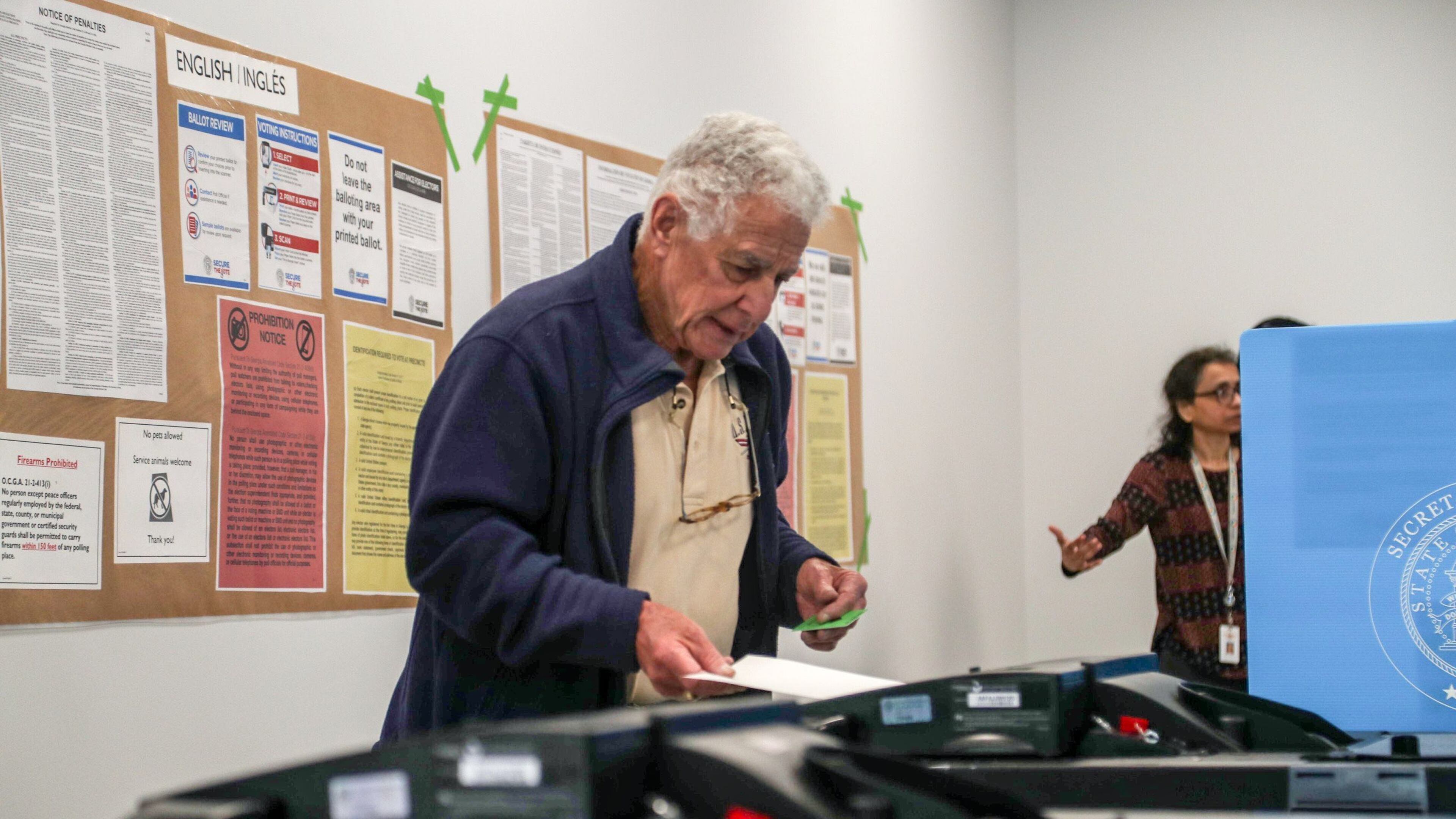 Hartley Falbaum of Loganville casts his ballot during early voting for the presidential primary at the Gwinnett County Voter Registrations and Elections office building in Lawrenceville, Monday, March 2, 2020. (Alyssa Pointer/AJC)