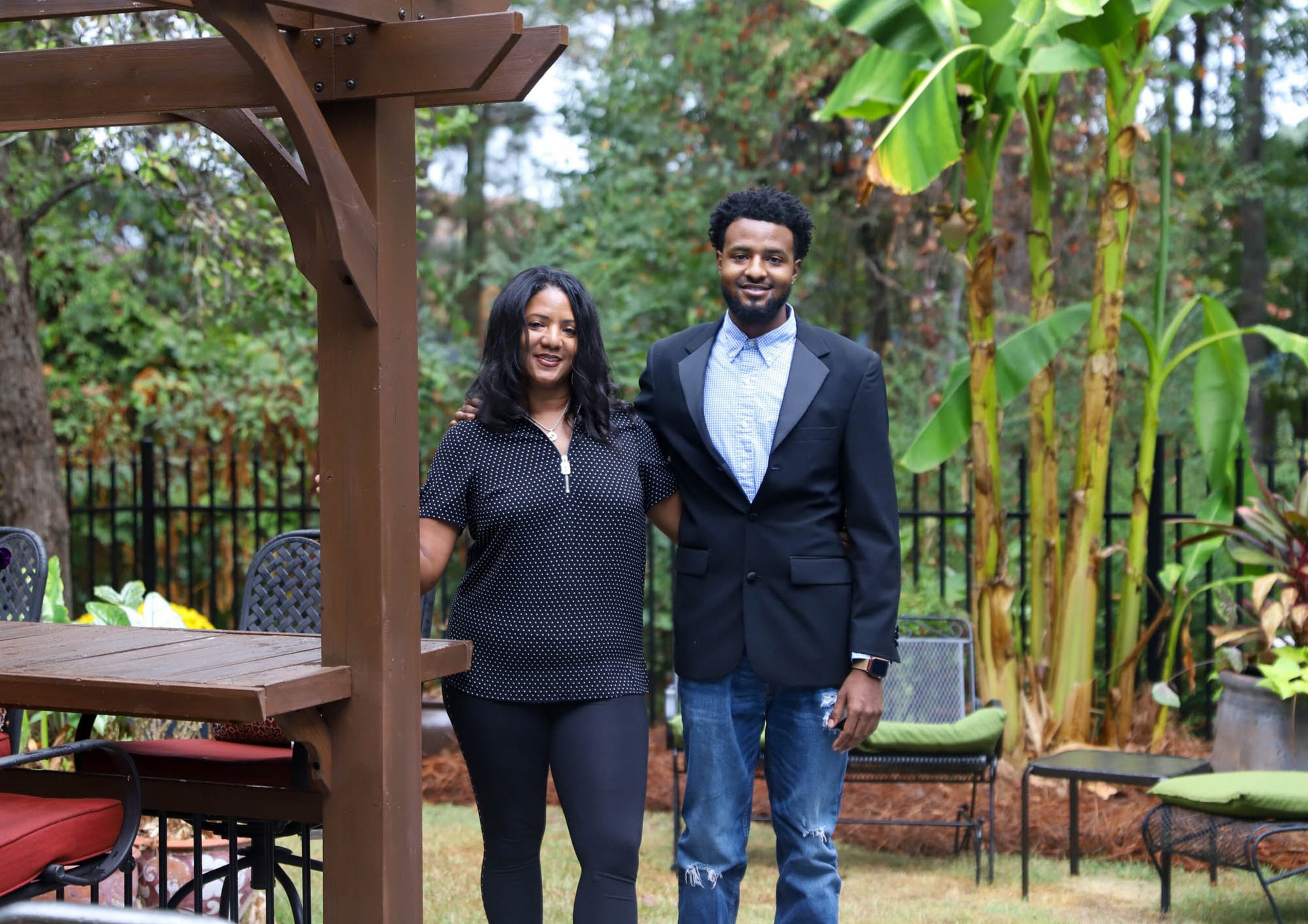 Nadine Faison moved into her DeKalb County home in 2011. Since then she has renovated the basement to make it the perfect area for entertaining, including a pool table and a media room. Faison is a manager at AT&T and is pictured here with her son, Joshua Faison. Text by Shannon Dominy. Photo by Reynolds Rogers.