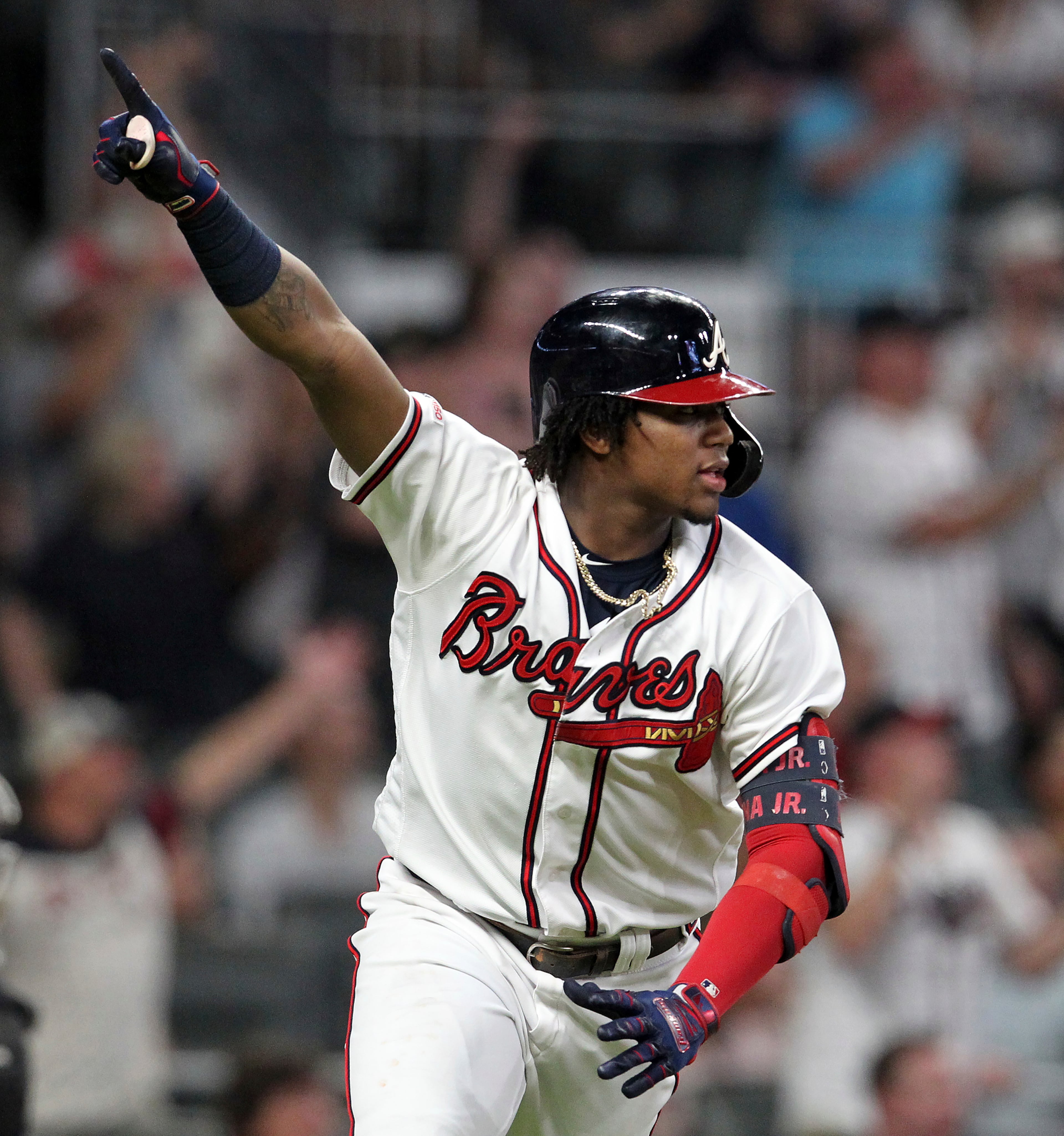 Atlanta Braves' Ronald Acuna Jr. reacts after he singled in the winning run against the Miami Marlins in the ninth inning of a baseball game Thursday, Aug. 22, 2019, in Atlanta. (AP Photo/Tami Chappell)