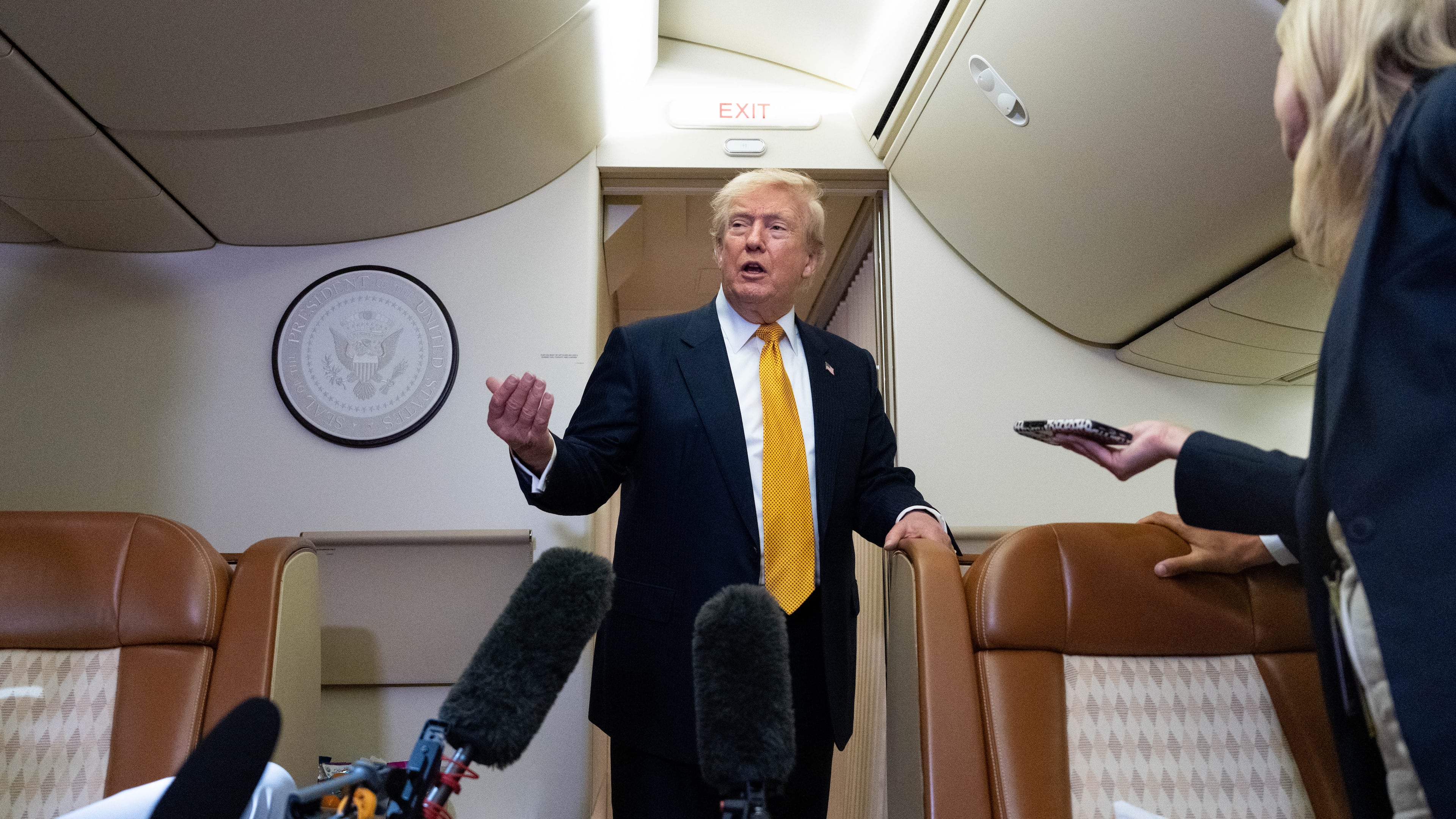President Donald Trump speaks with reporters in flight on Air Force One after landing at U.S. Air Force Base at RAF Mildenhall, in Suffolk, Eastern England, Wednesday, July 8, 2026. (AP Photo/Alex Brandon)