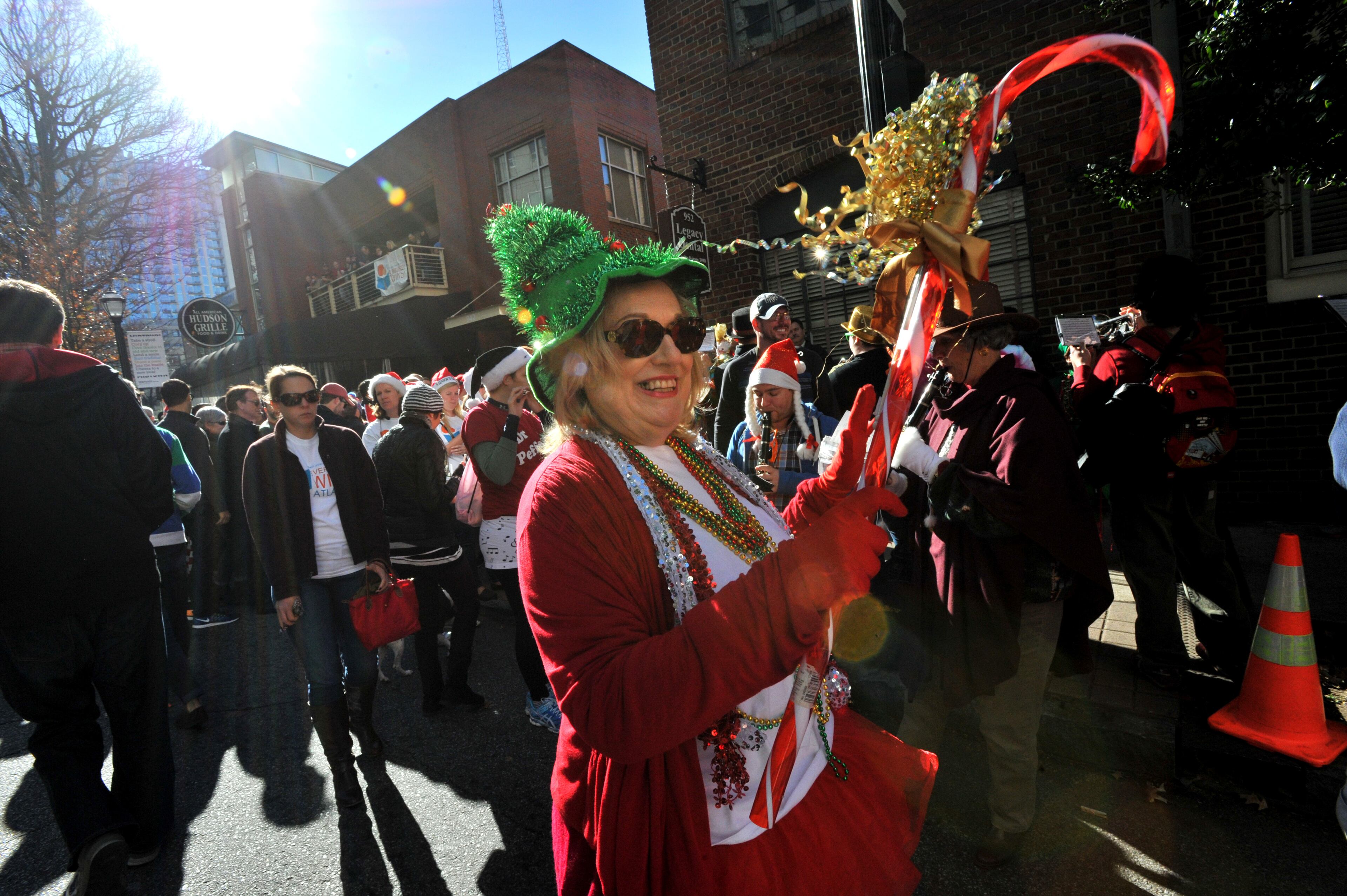 December 13, 2014 Atlanta - A member, from Seed & Feed Marching Abominable, performs to entertain spectators during Atlanta Santa Speedo Run at Hudson Grill Midtownon Saturday, December 13, 2014. The race is run to raise money during the 2014 Santa Speedo Run. These 'lightly' dressed Santas are fundraising to support Everybody Wins! Atlanta, a nonprofit devoted to improving children's reading skills that below current grade level. HYOSUB SHIN / HSHIN@AJC.COM