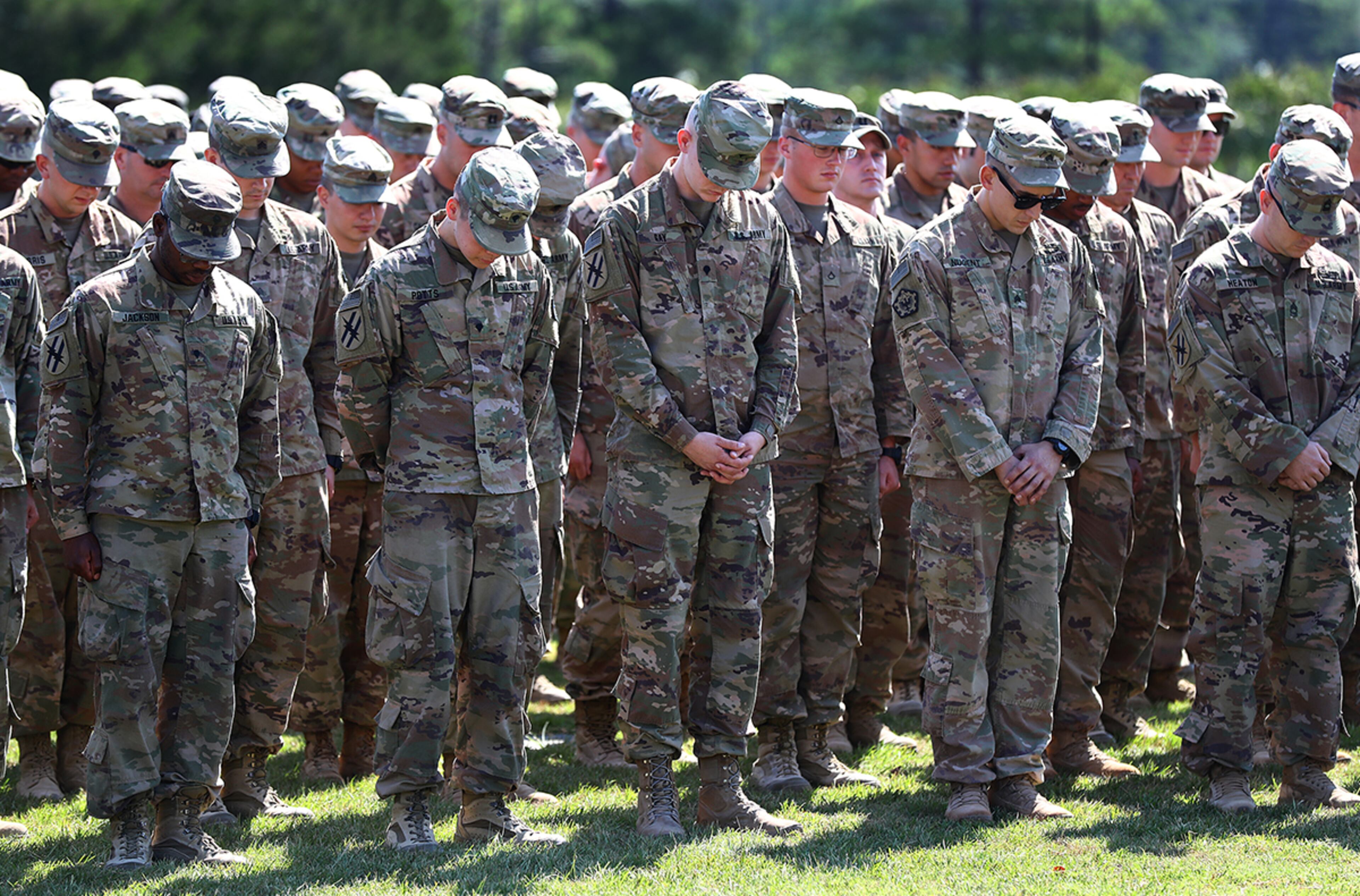 July 30, 2019 Fort Stewart: Soldiers of the 48th Infantry Brigade Combat Team representing units from across the state bow in prayer at Cottrell Field before being released to their loved ones as they return home from deployment to Afghanistan in support of Operation Resolute Support on Tuesday, July 30, 2019, at Fort Stewart. Curtis Compton/ccompton@ajc.com