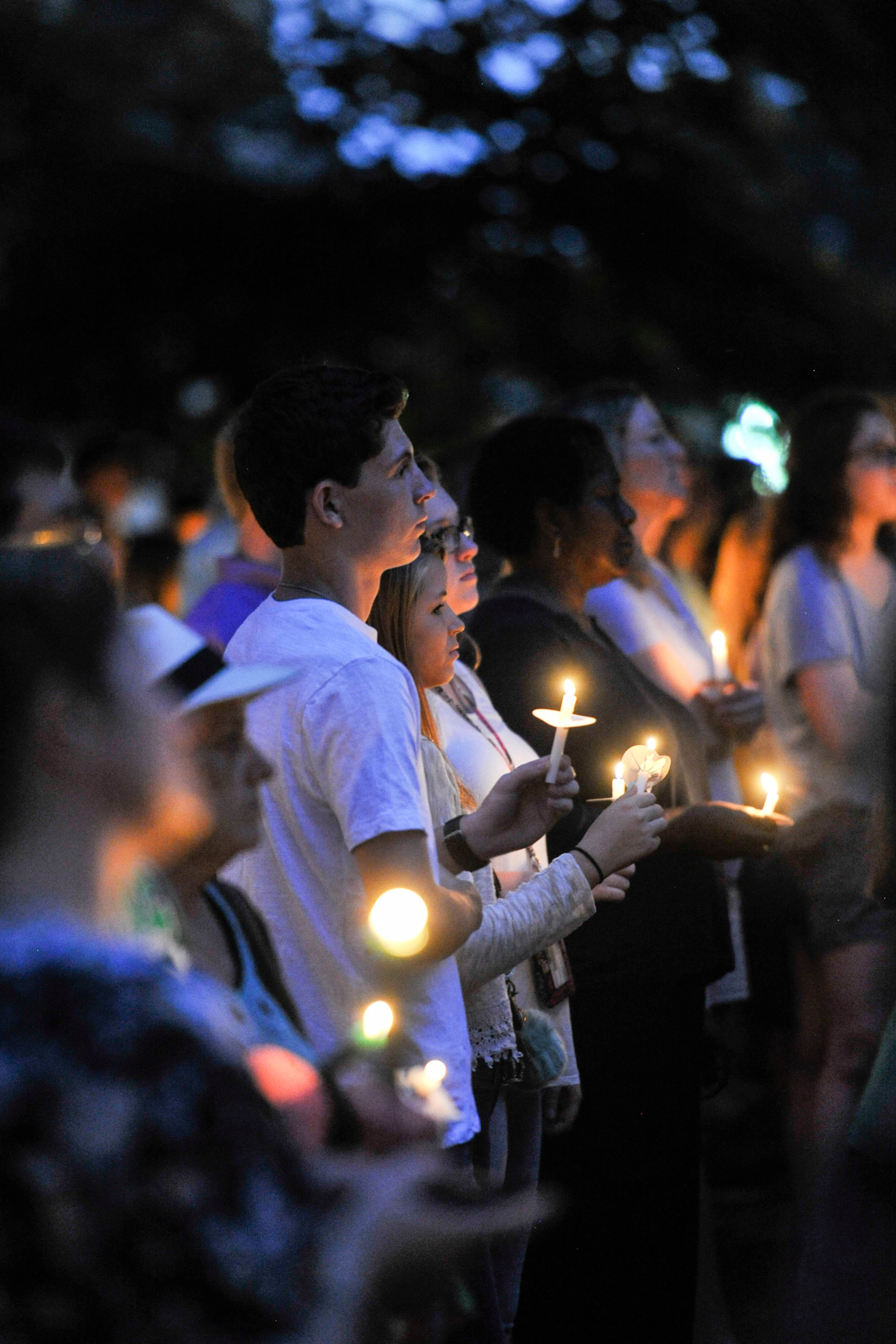Friends of Natalie Henderson attend a vigil held for her on the old Roswell Square, Thursday, Aug. 4, 2016. Henderson, of Woodstock, and Carter Davis of Woodstock, both 17, were found Monday behind a Publix grocery store shot to death. Jeffrey A. Hazelwood, 20, was arrested Wednesday and will be charged with two counts of murder in the deaths. (Photo Contributed by John Amis)