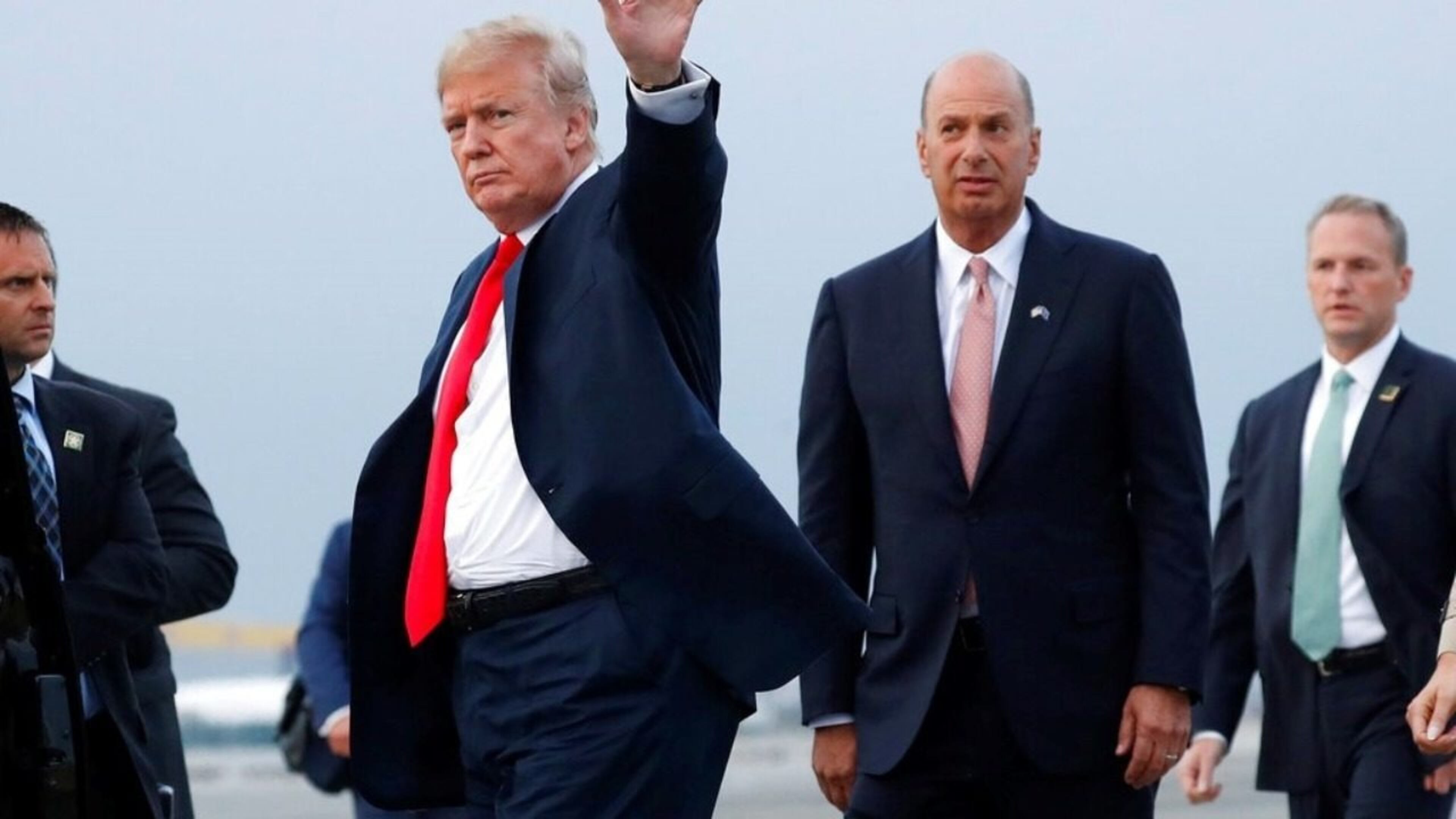 President Donald Trump is joined by Gordon Sondland, the U.S. ambassador to the European Union, second from right, in July 2018, as he arrives at Melsbroek Air Base, in Brussels, Belgium.