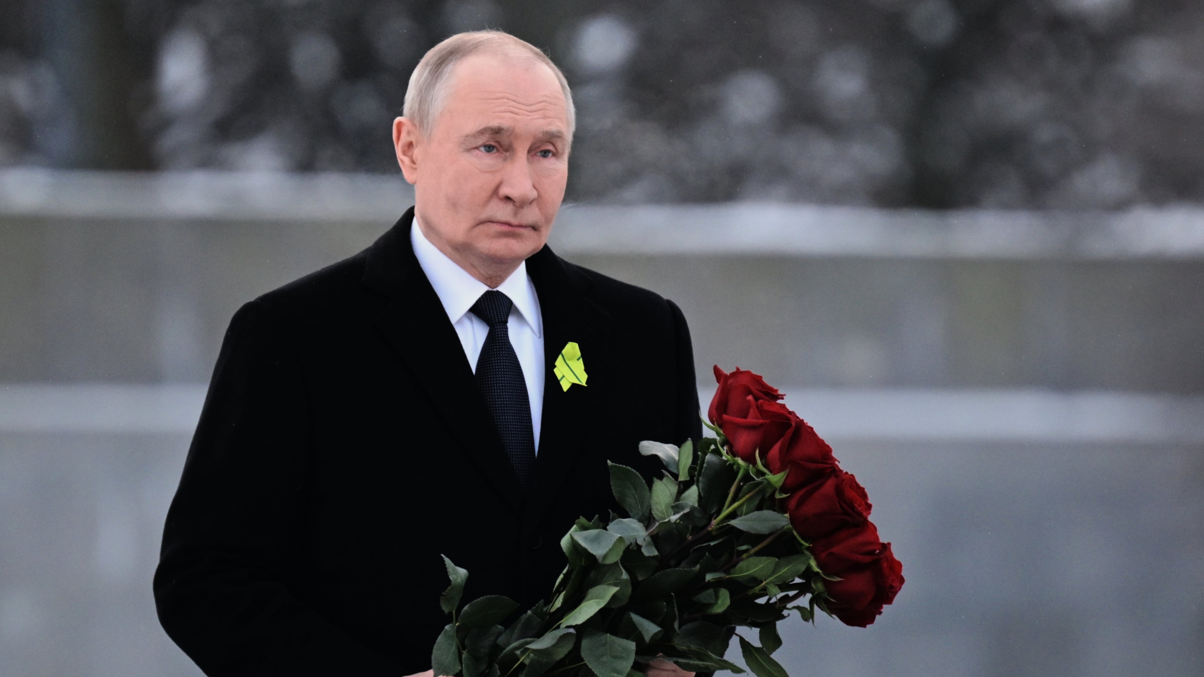 Russian President Vladimir Putin lays flowers at the grave of his brother, who died as a child during the siege of Leningrad, during a commemoration ceremony at the Piskaryovskoye Cemetery, where most of the Leningrad Siege victims were buried, marking the 82nd anniversary of the World War II battle that lifted the Nazi siege of Leningrad, in St. Petersburg, Russia, Tuesday, Jan. 27, 2026. (Alexei Danichev/Sputnik, Kremlin Pool Photo via AP)