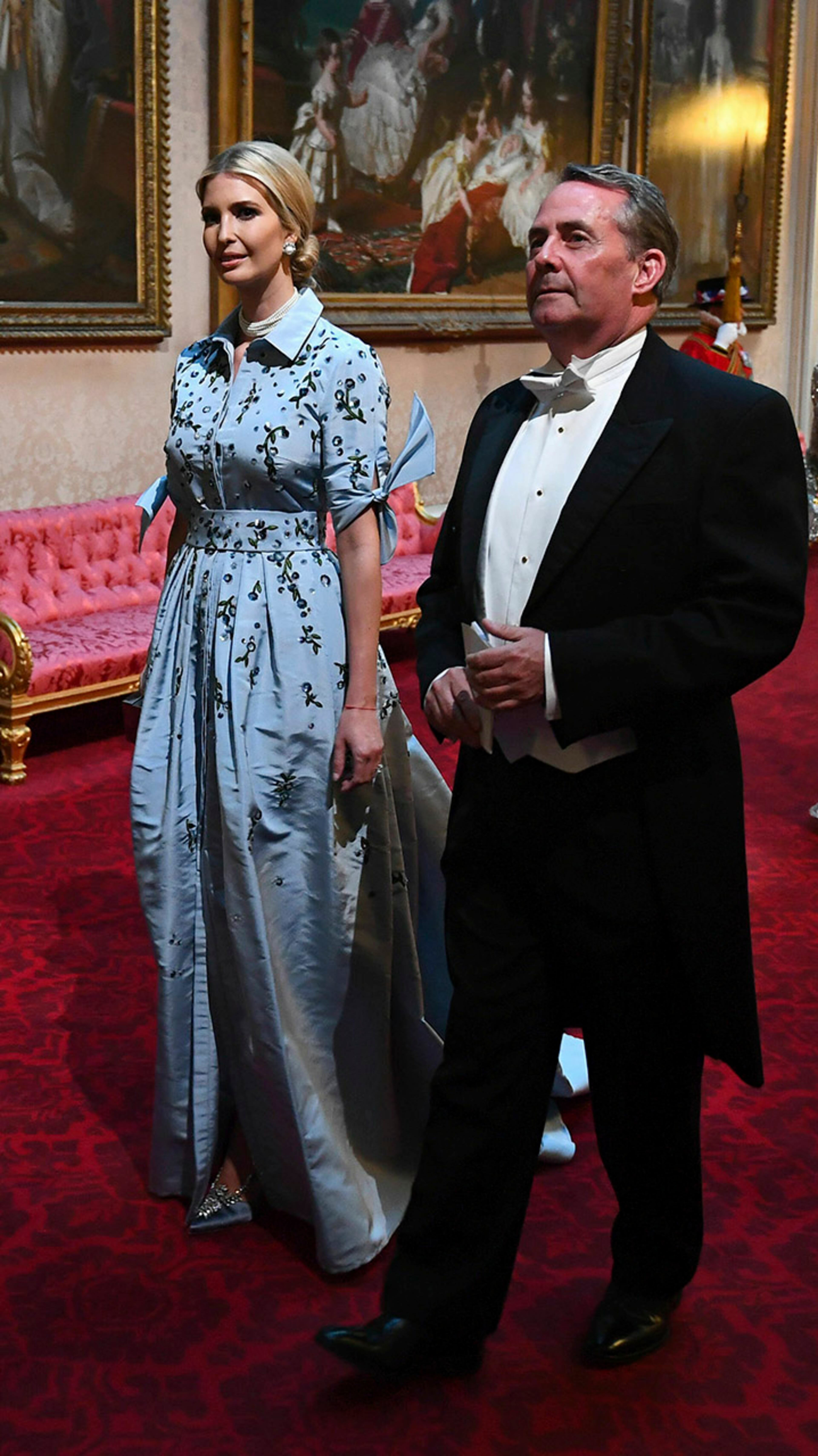 Ivanka Trump and Secretary of State for International Trade Liam Fox arrive through the East Gallery during the state banquet at Buckingham Palace in London on Monday, June 3, 2019. President Donald Trump is on a three-day visit to the United Kingdom.