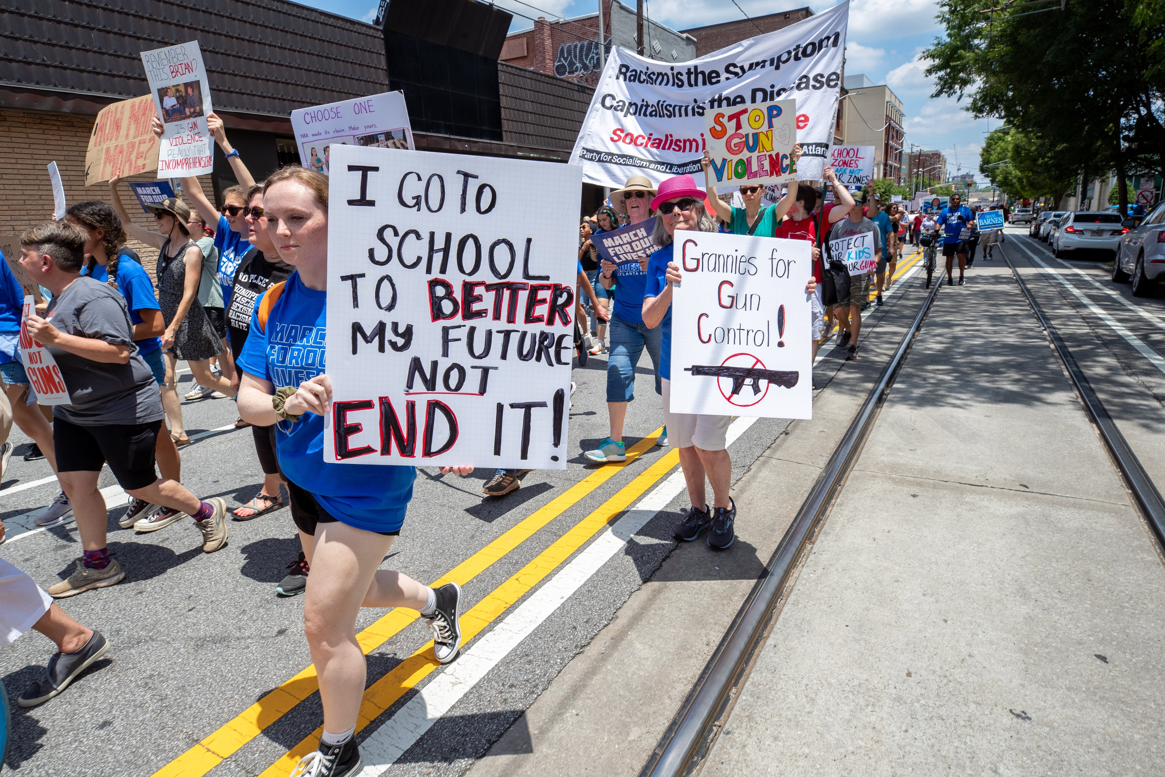 A large crowd leaves Ebenezer Baptist Church and heads down Edgewood Avenue toward Woodruff Park during the March for Our Lives on Saturday, June 11, 2022. (Steve Schaefer / steve.schaefer@ajc.com)
