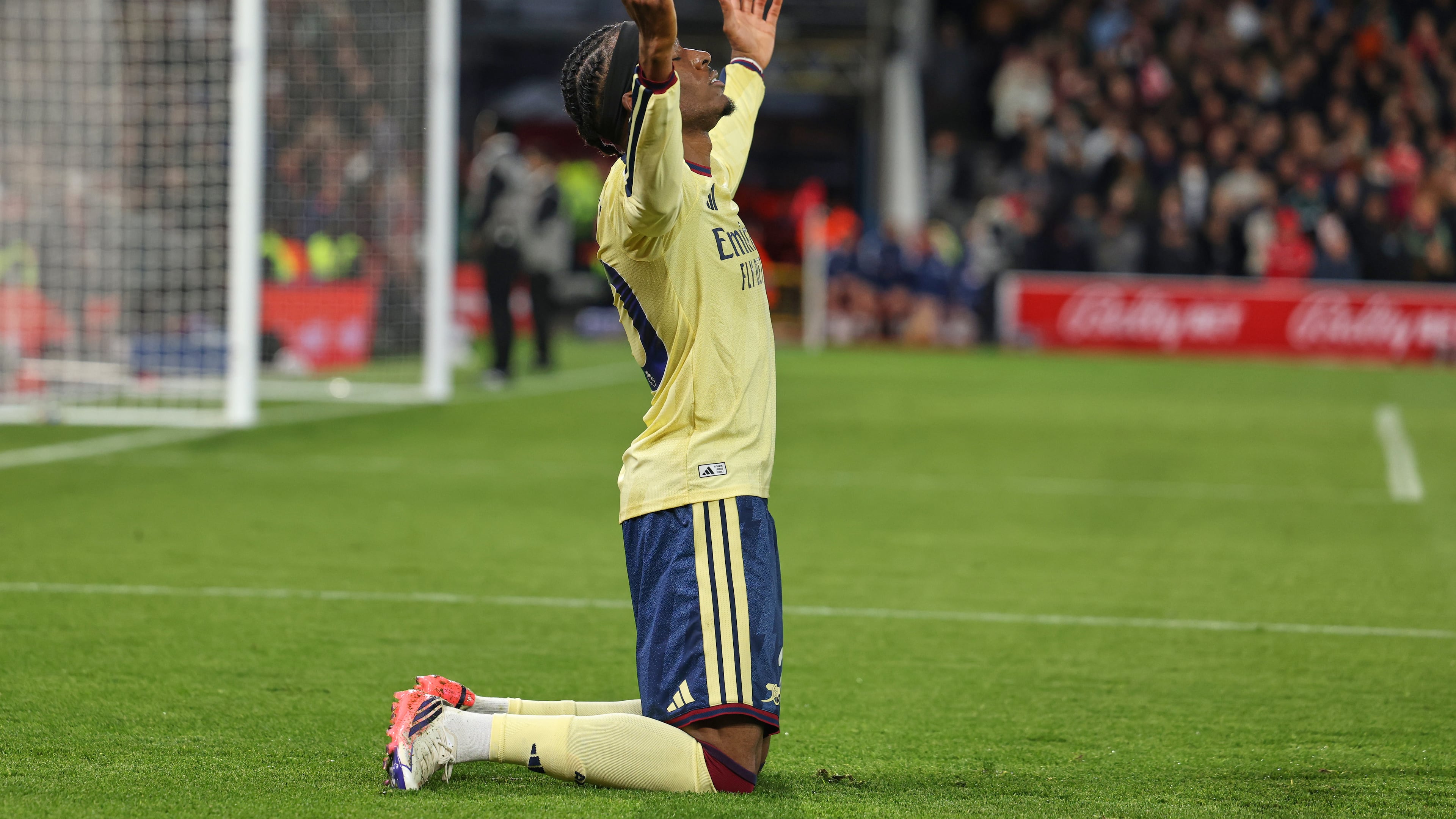 Arsenal's Noni Madueke celebrates after scoring his side's opening goal during the English Premier League soccer match between Nottingham Forest and Arsenal in Nottingham, England, Sunday, Oct. 18, 2026. (AP Photo/Maddy Grassy)