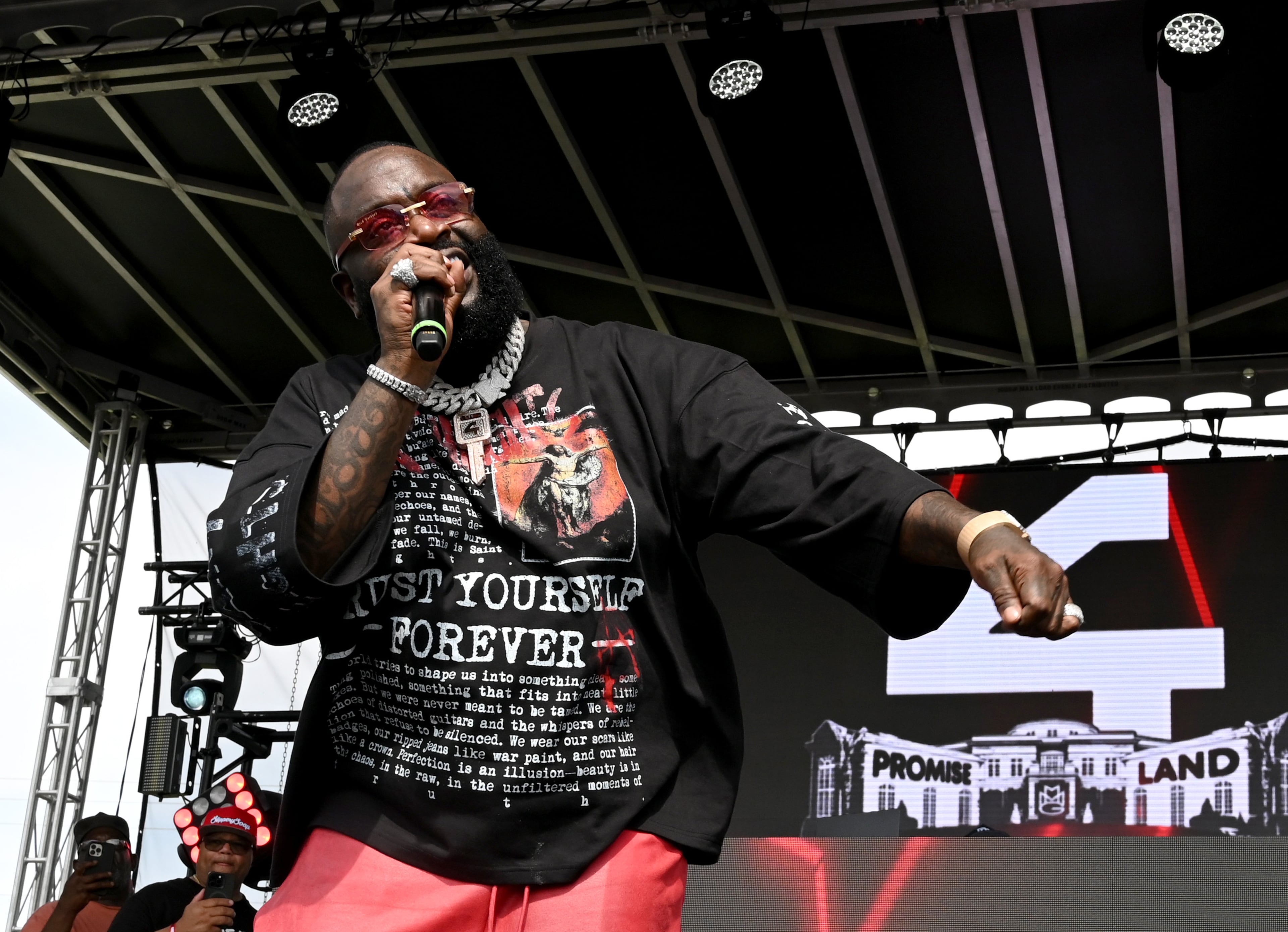 Rick Ross performs during the 4th Annual Rick Ross Car and Bike Show, Saturday, June 7, 2025, in Fayetteville. The 4th Annual Rick Ross Car and Bike Show will include a vendor market with more than 30 vendors, food trucks, fleets of classic/custom automobiles, luxury vehicles, boats, RVs and trailers on the front of the mansion. Stage performances include Plies, Ross' new signee Nino Breeze and Ross himself. (Hyosub Shin / AJC)