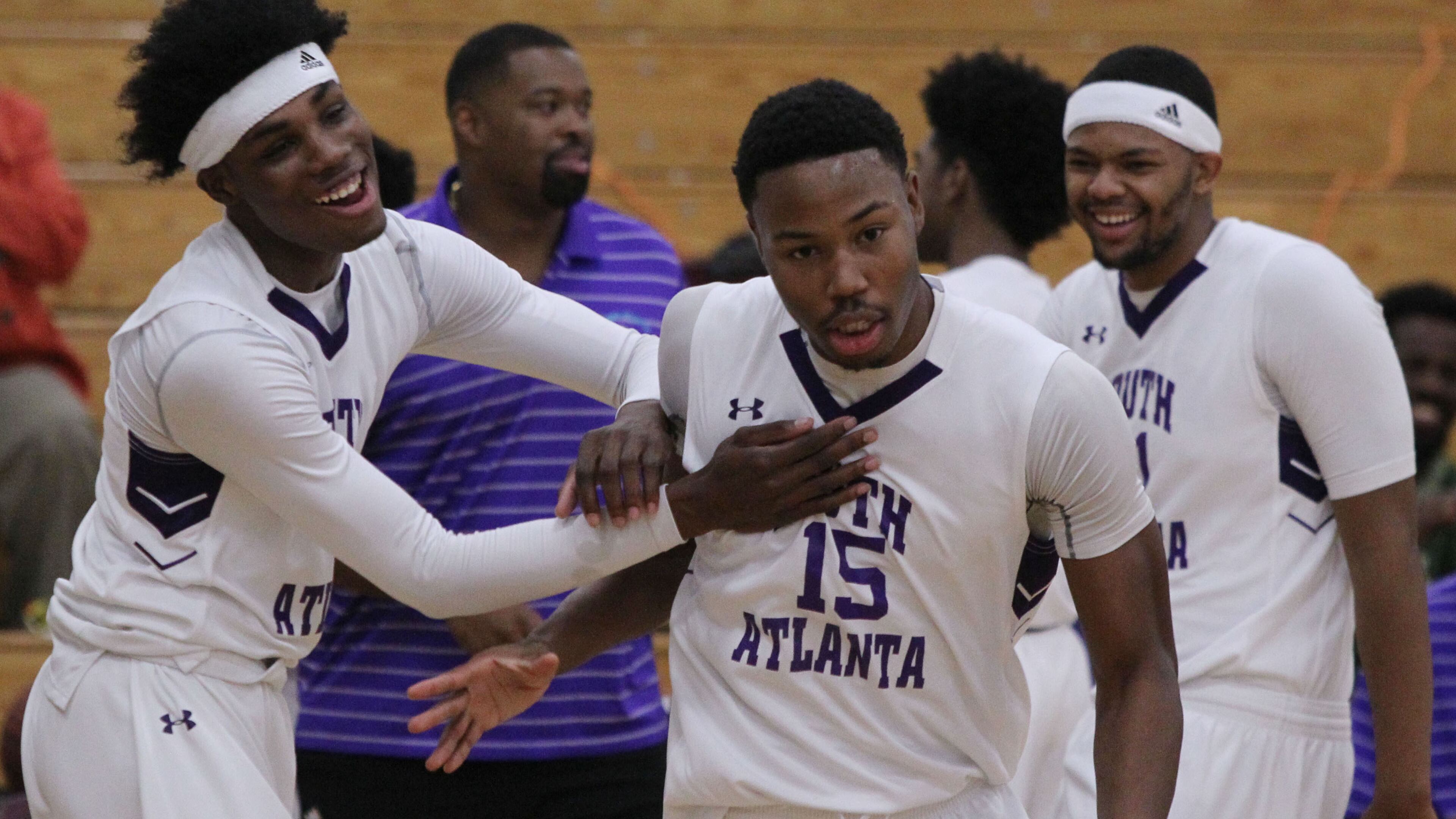South Atlanta forward Tyler Thornton (15) receives a warm welcome from his team mates at the start of a game in Atlanta on Thursday, Jan. 12, 2017. (Henry Taylor/AJC)