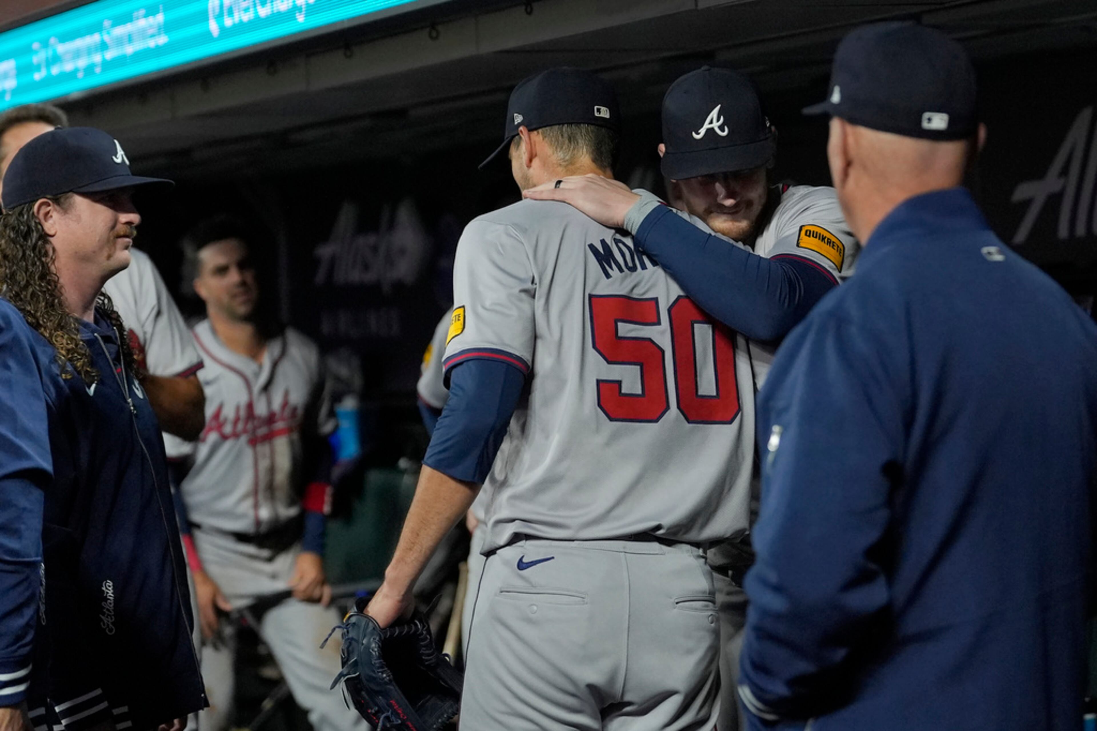 Atlanta Braves pitcher Charlie Morton (50) is congratulated by teammates after the sixth inning of a baseball game against the San Francisco Giants in San Francisco, Tuesday, Aug. 13, 2024. (AP Photo/Jeff Chiu)