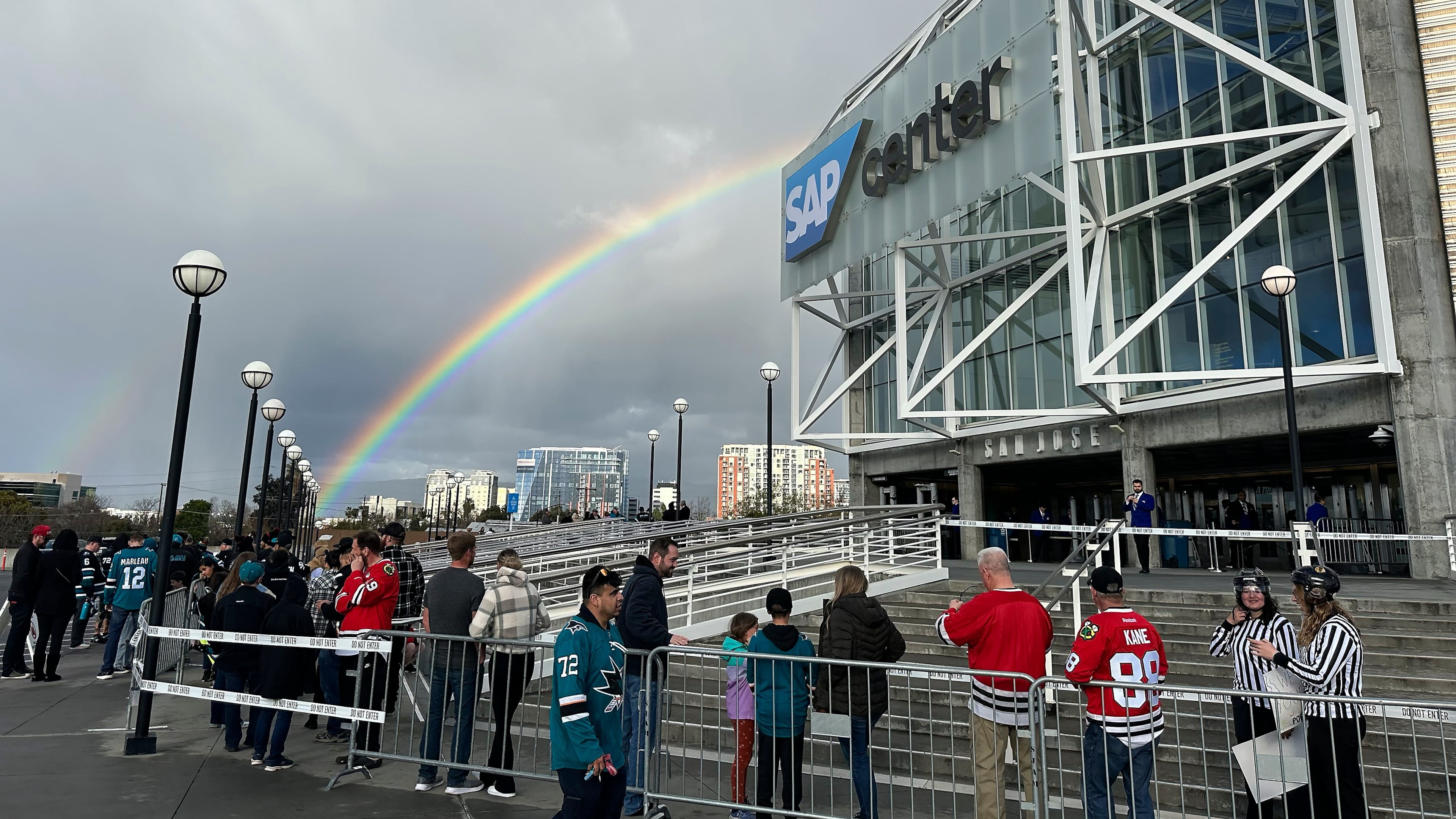 FILE - A rainbow is shown as fans line up outside SAP Center at San Jose before an NHL hockey game between the Chicago Blackhawks and the San Jose Sharks in San Jose, Calif., March 23, 2024. (AP Photo/Jeff Chiu, File)